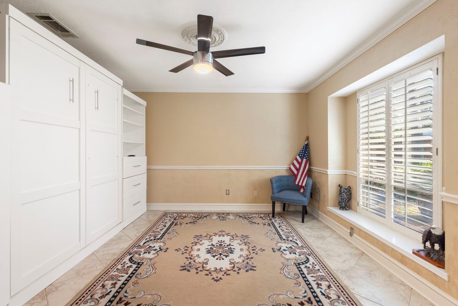 8202 Forest Ridge Road, Spring, TX 77379 This study overlooks the front yard, has french door access, plantation shutters and extensive Murphy Bed cabinet built-in making it the perfect home office + space for guests when they come.