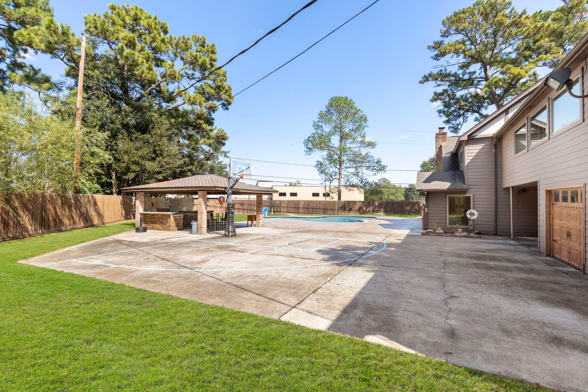 8202 Forest Ridge Road, Spring, TX 77379 This backyard has been known to host highschool sports teams with so much space to hange out and play.