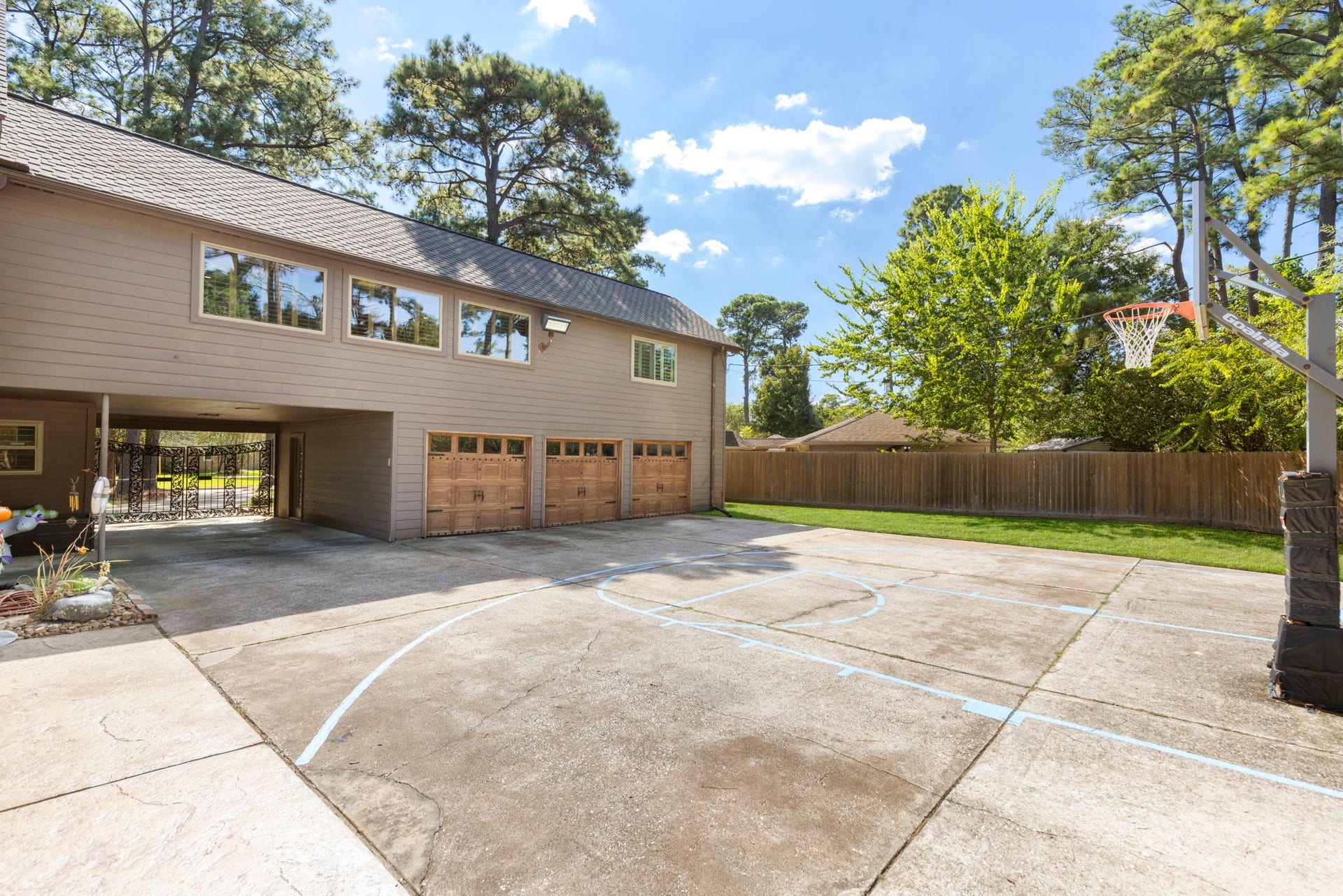 8202 Forest Ridge Road, Spring, TX 77379 Huge patio area with basketball court is so unique and fun!