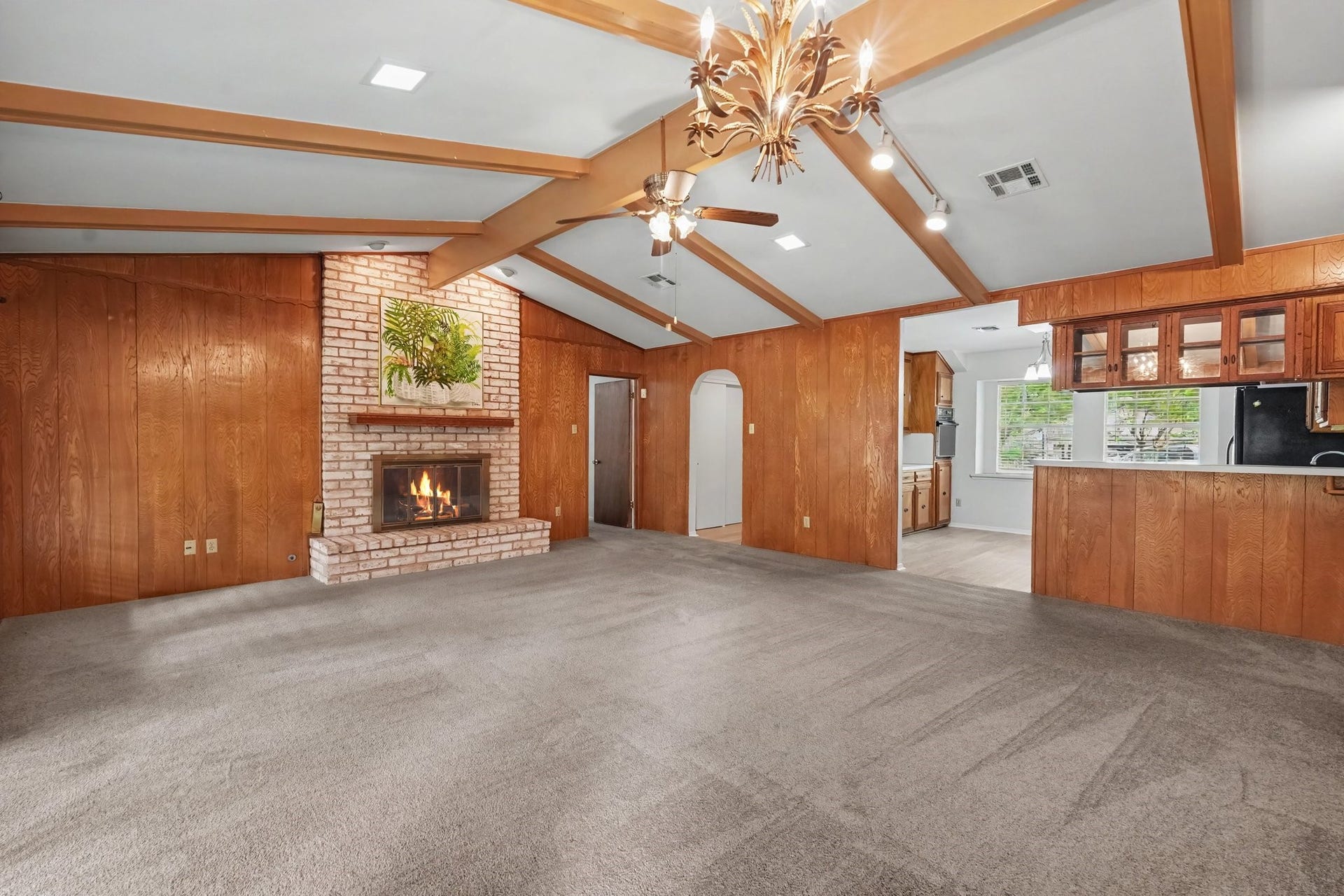 429 Deep Dale Lane, Conroe, TX 77304 This cozy brick fireplace and hearth provide a warm, inviting focal point perfect for gatherings.