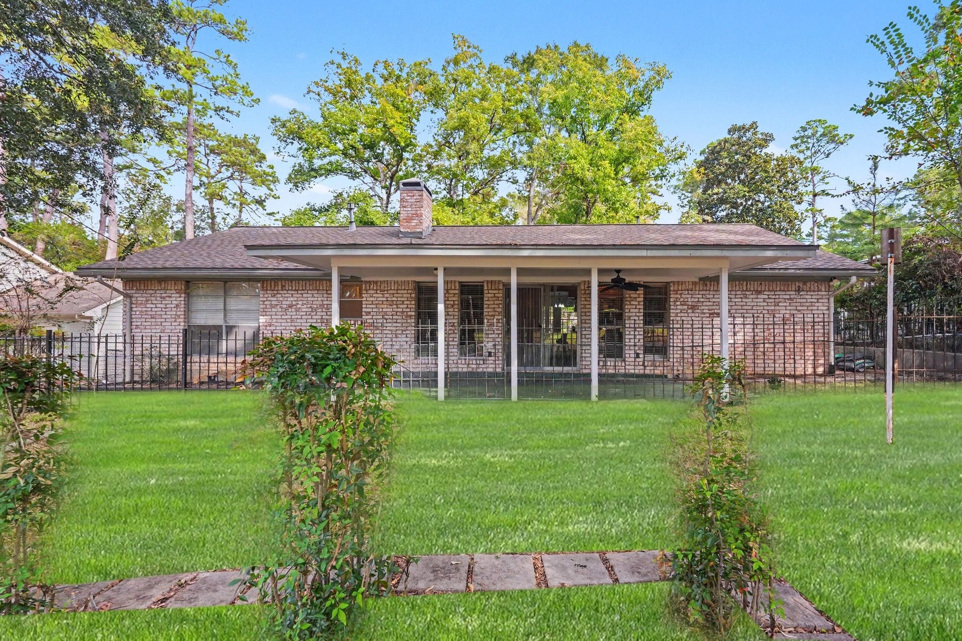 429 Deep Dale Lane, Conroe, TX 77304 This view shows the expansive covered patio! Sit and wave to the golfers as they pass by!