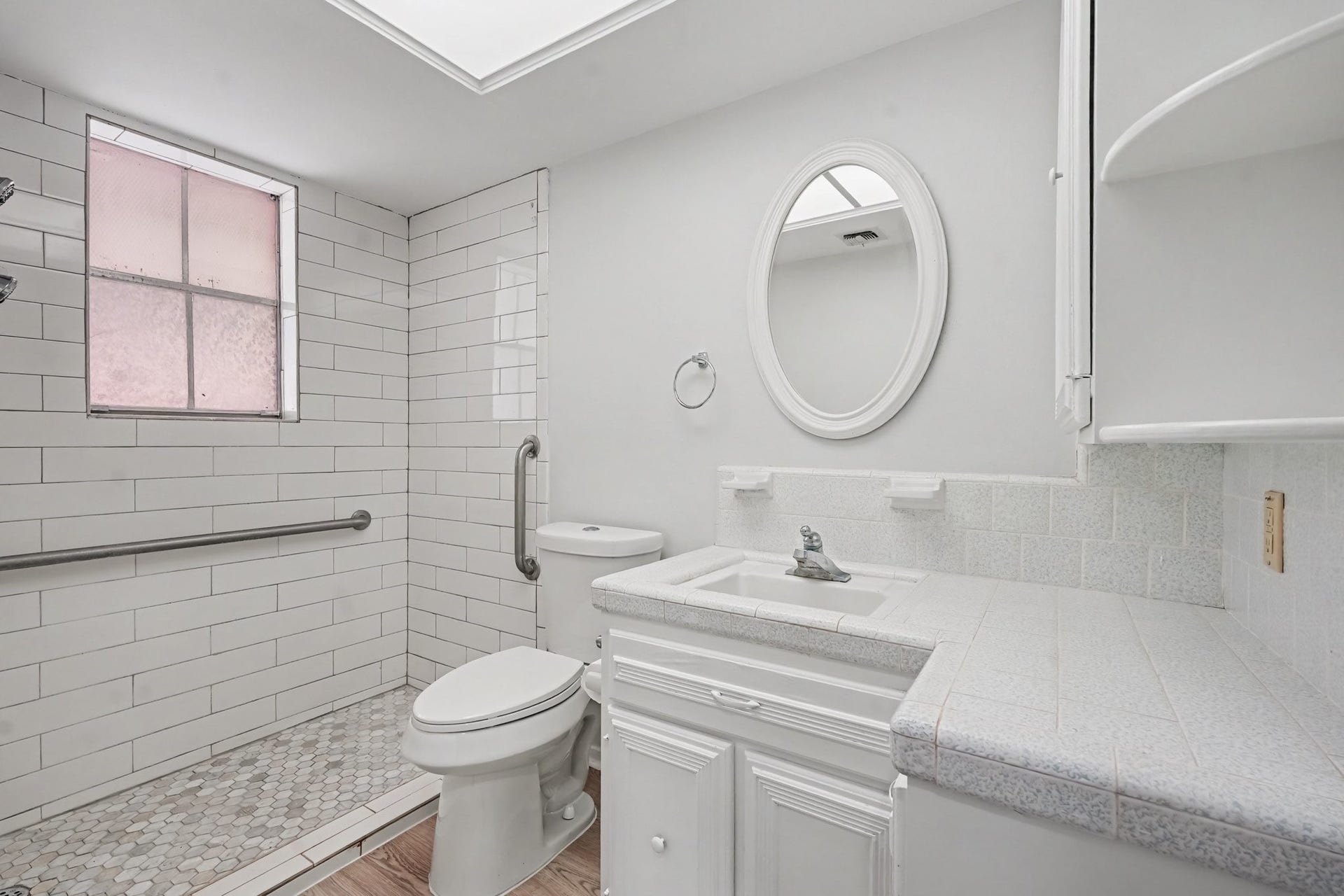 429 Deep Dale Lane, Conroe, TX 77304 Bright and spacious oversized walk-in shower featuring accessible design elements, modern finishes, and built-in storage.