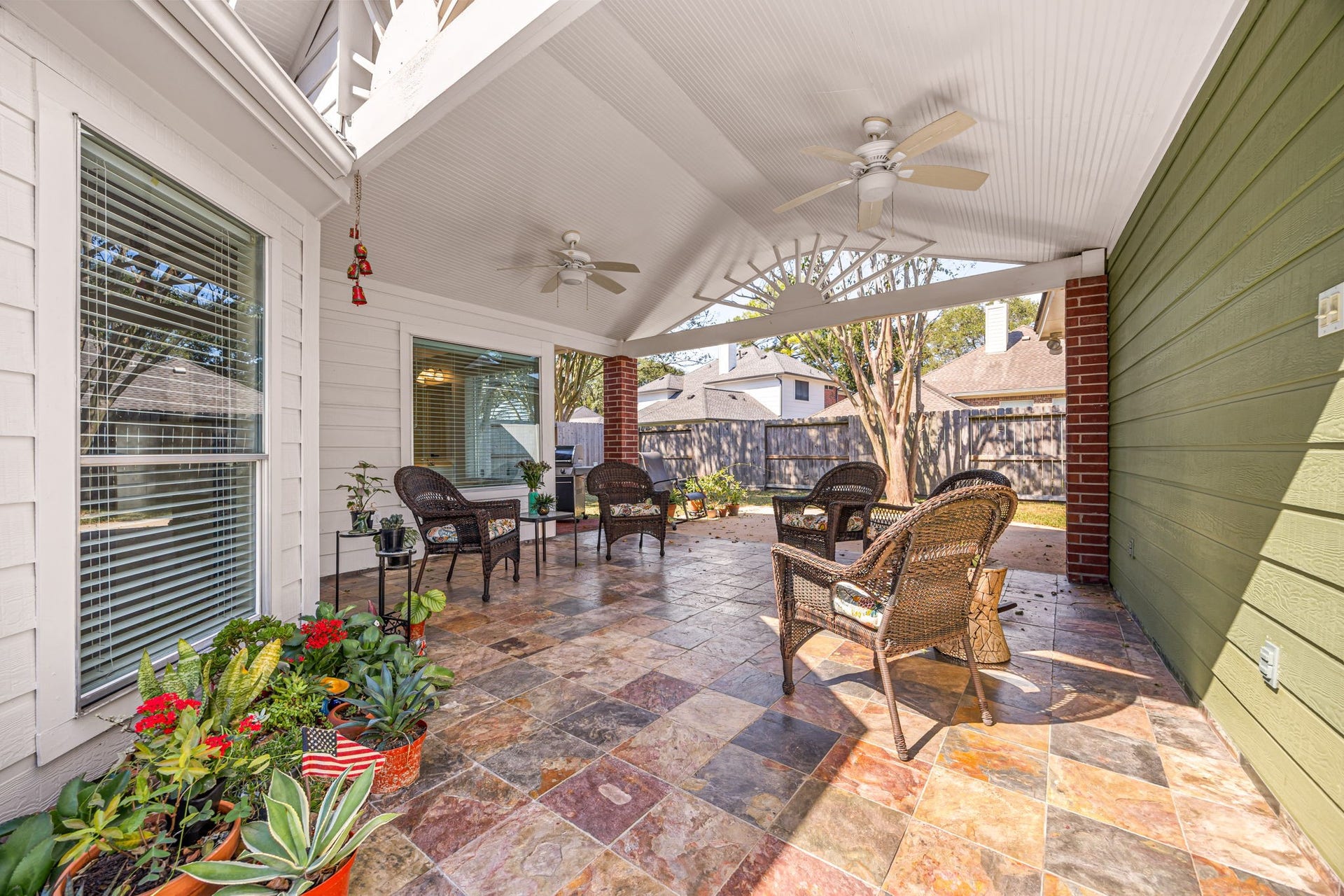 8327 E Copper Village Drive, Houston, TX 77095 Complete with dual ceiling fans, the covered patio offers the perfect spot to unwind year-round, rain or shine.