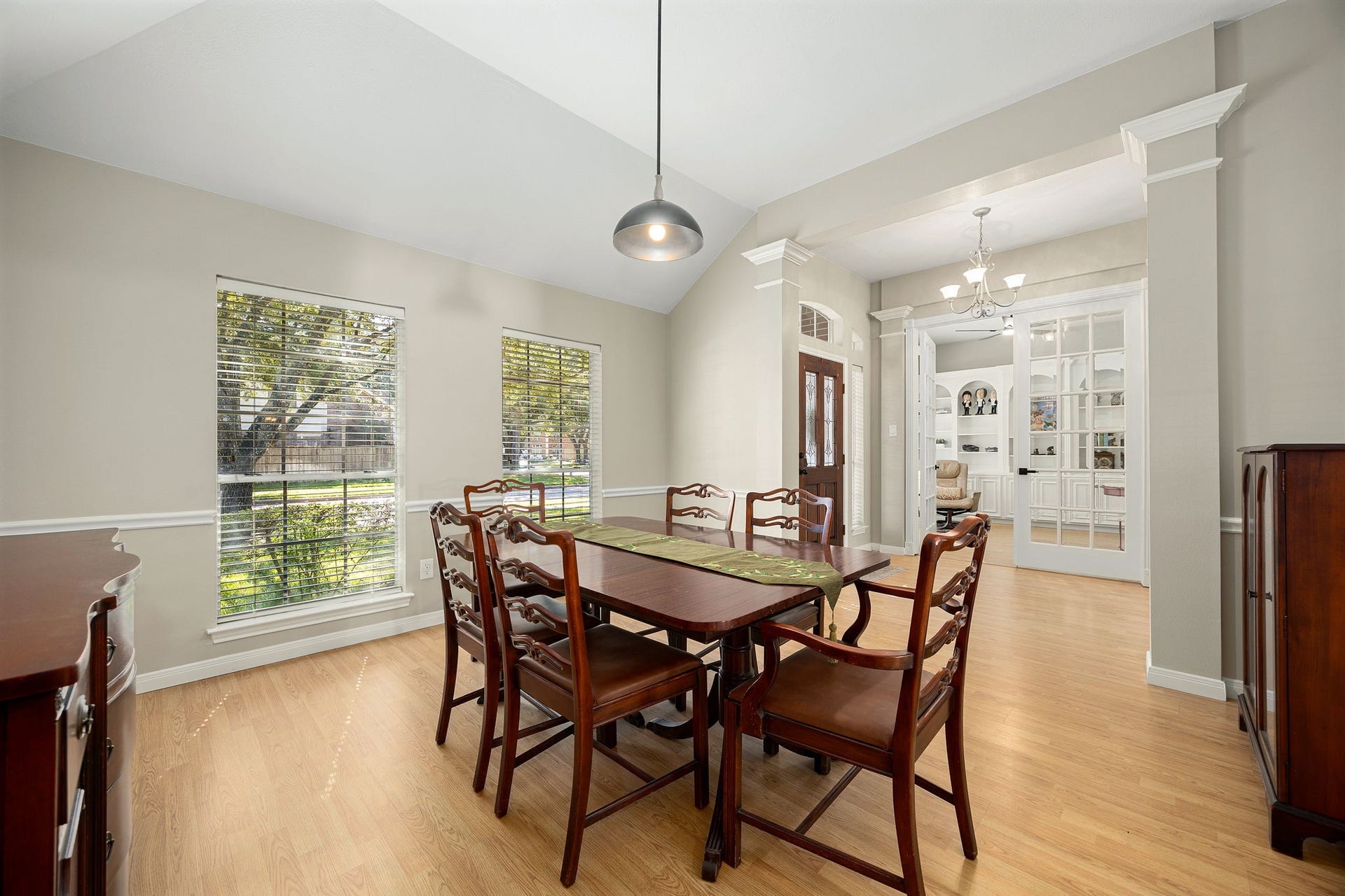 8327 E Copper Village Drive, Houston, TX 77095 The formal dining area offers plenty of space for entertaining, with a glimpse into the home office beyond, featuring the built-in bookcase.