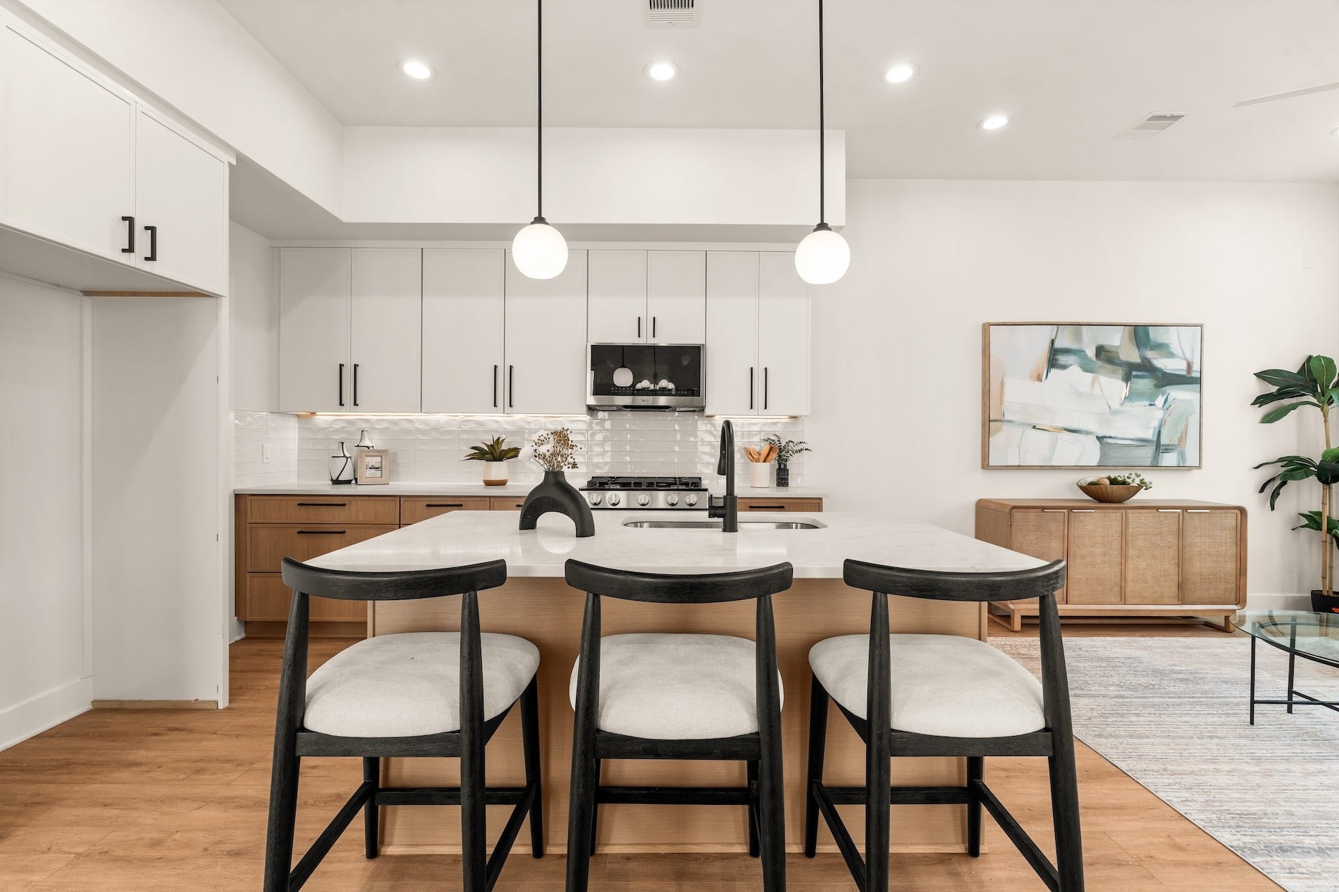 Chef-inspired island layout complete with under-cabinet lighting and sleek soft-close storage.