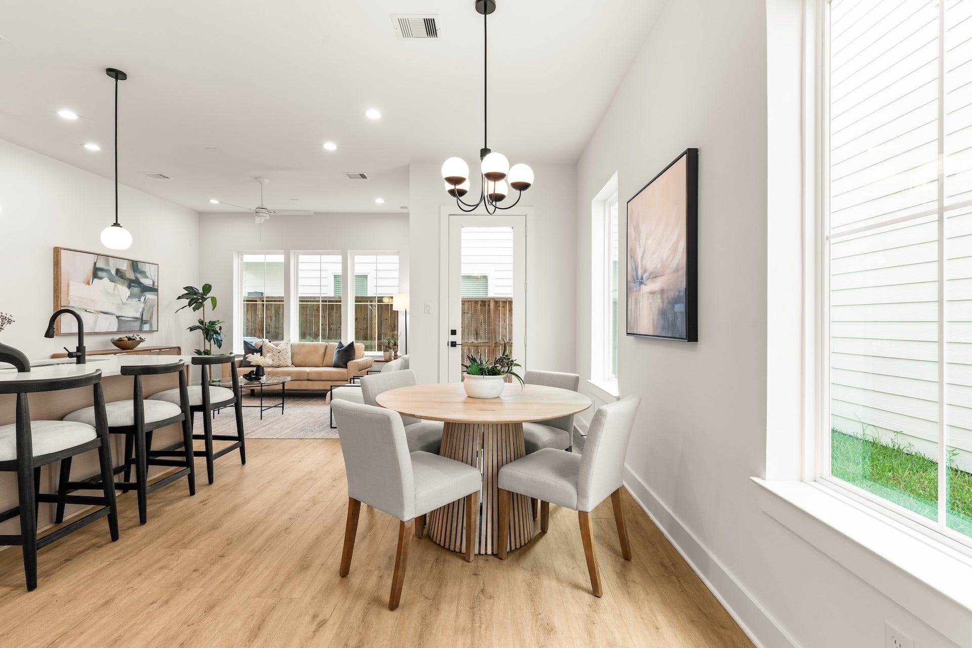 Sunlit dining nook seamlessly open to the kitchen for casual everyday meals.