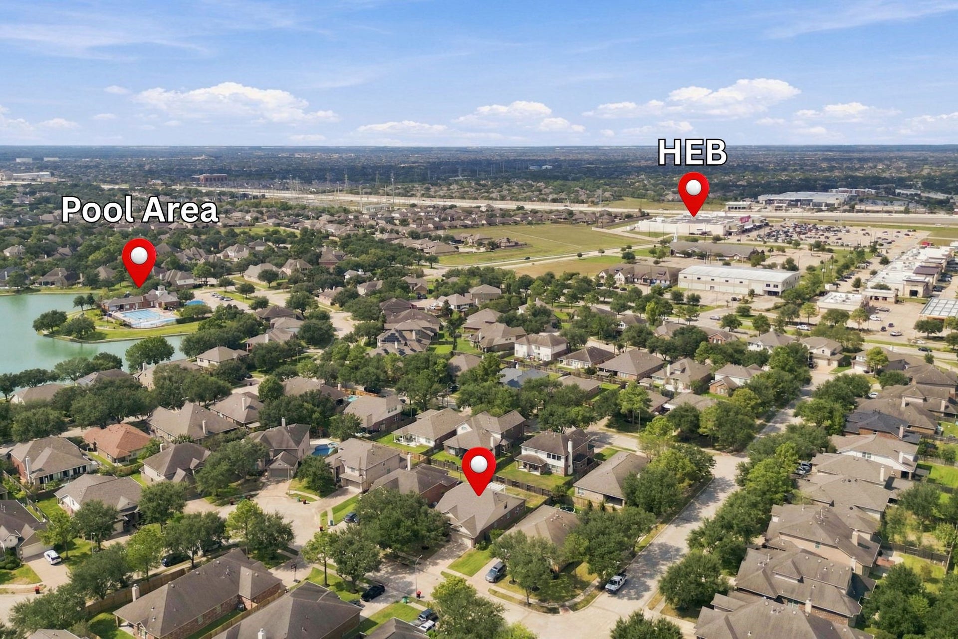 This aerial view highlights the desirable location of this home. Situated within a gated section of Westheimer Lakes, residents enjoy convenient access to the neighborhood pool area and lake with walking trail. The home is also just minutes from H-E-B, providing easy access to everyday shopping and conveniences.