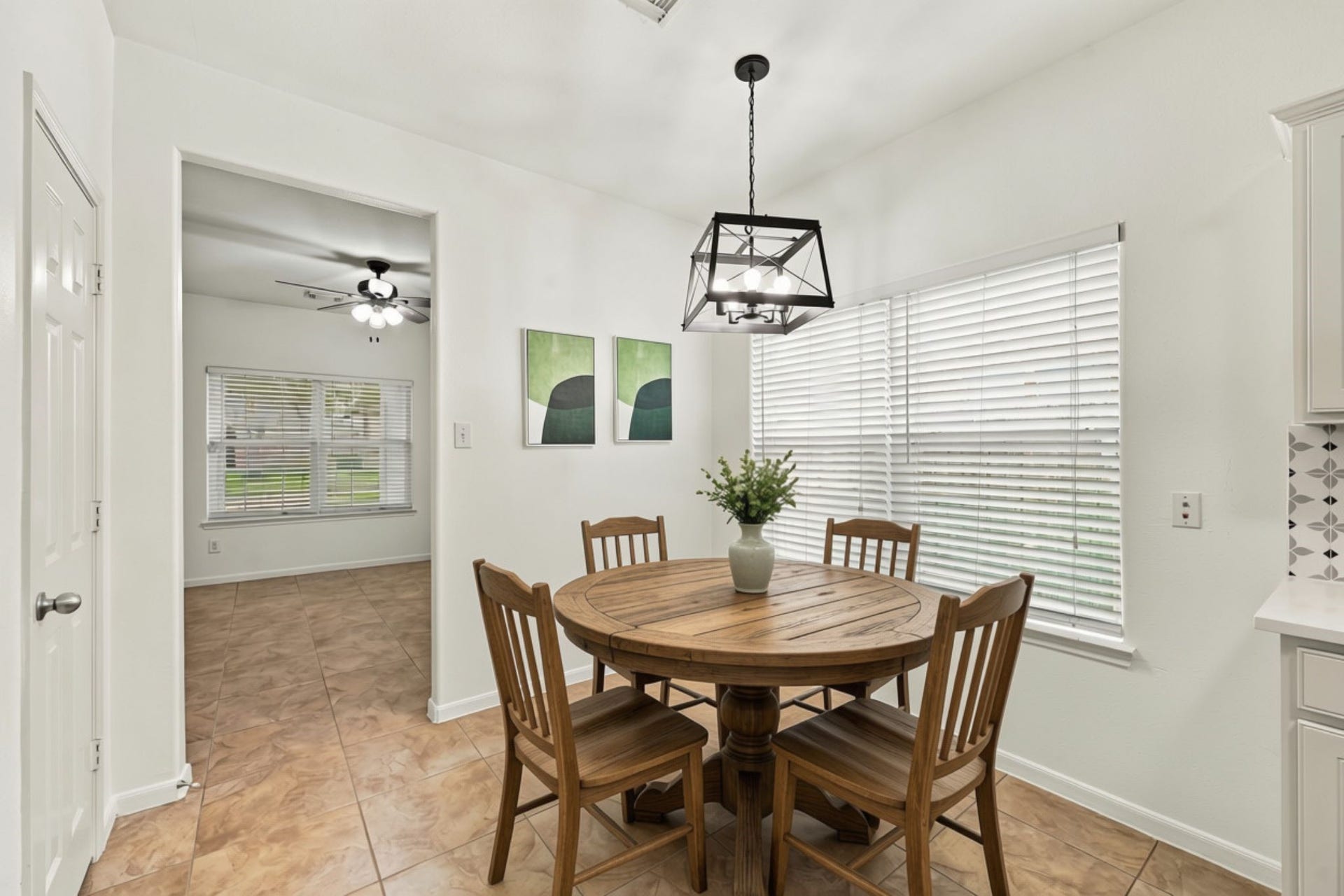 The Kitchen and Breakfast Area offer direct access to the Formal Dining Room, which can also be used as a Home Office. A conveniently located pantry just to the left provides additional storage and functionality. (Virtually Staged)