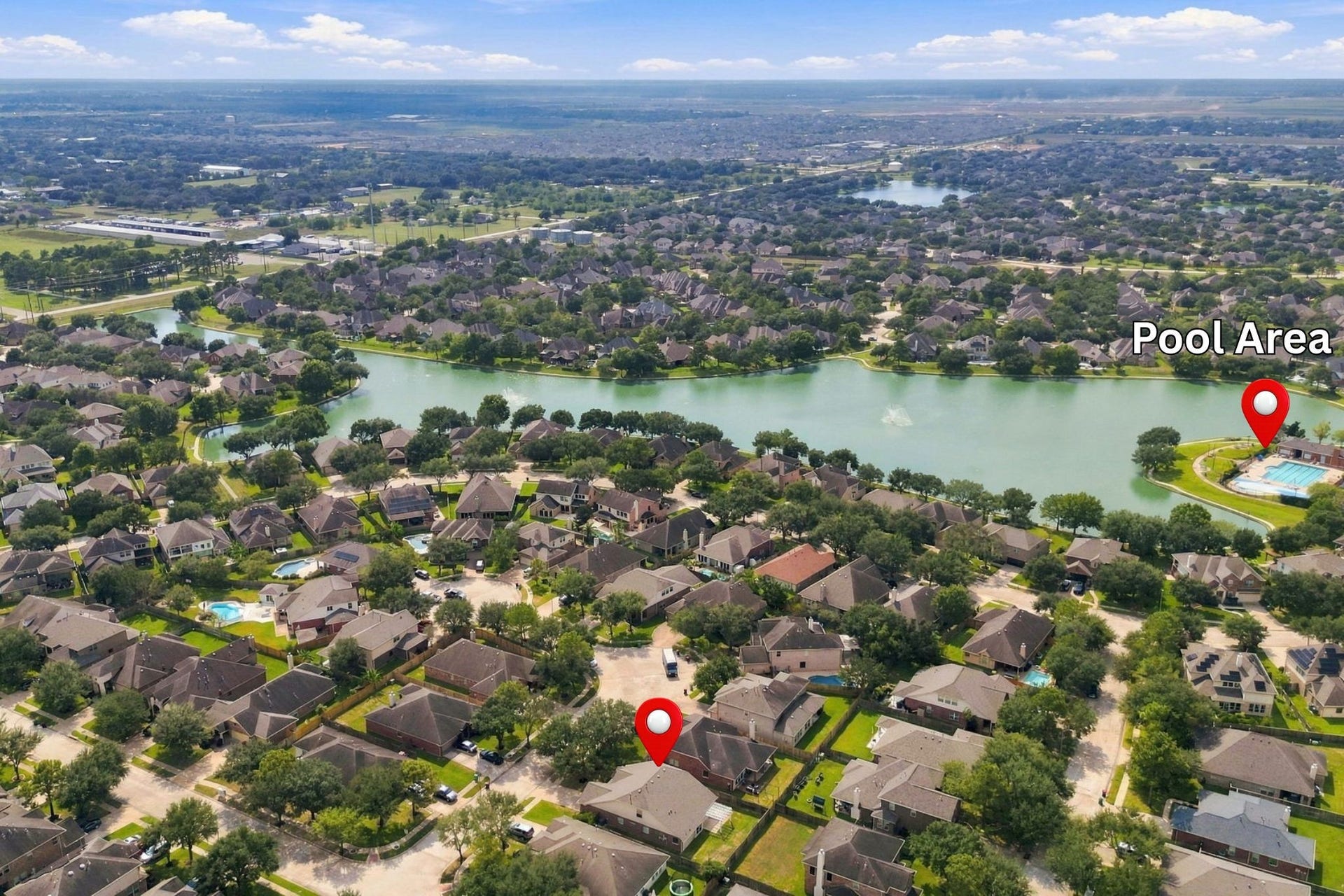 This aerial view provides a closer look at the community lake and pool area. Both the home and pool area have been pinpointed for your convenience.