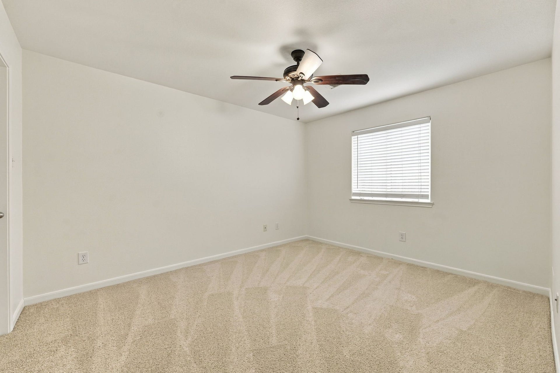 This homes versatile floor plan offers 3 Bedrooms downstairs, with an additional Bedroom, Full Bath, and Game Room upstairs. All Secondary Bedrooms are generously sized and feature ample closet space. This first-floor Bedroom includes newly installed carpet, a large window with 2-inch blinds, an oil-rubbed bronze five-blade ceiling fan and access to a Full Bath.