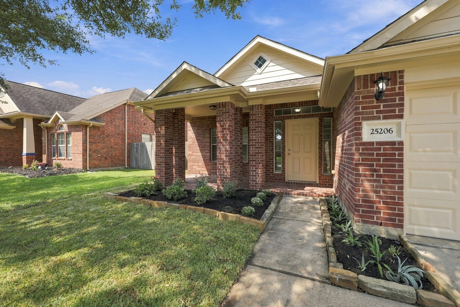As you make your way to the front entrance, youll appreciate the newly installed landscaping accented by a decorative stone border. The inviting covered Front Porch features a brick floor and brick columns, creating a warm and welcoming first impression.