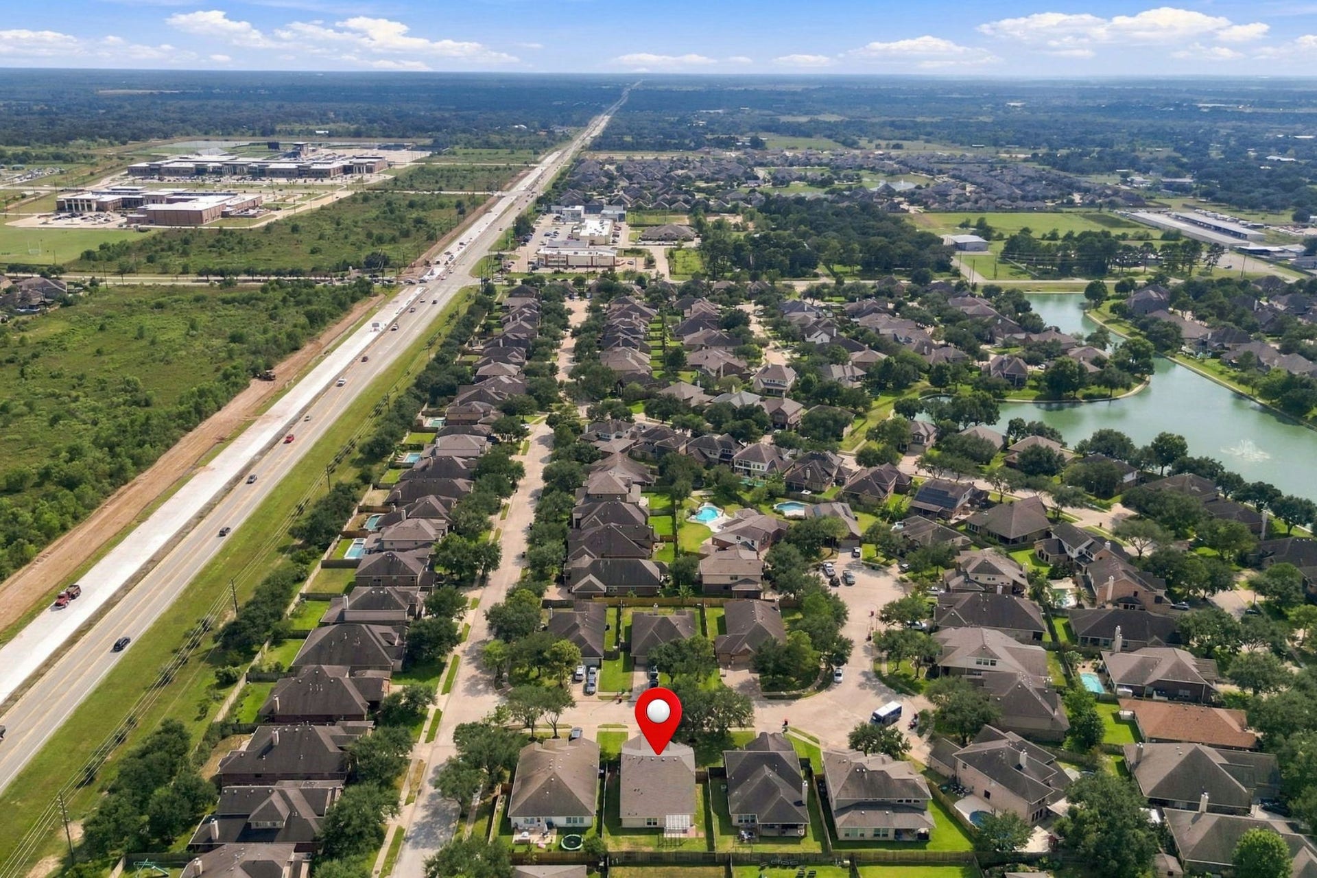 The home is ideally positioned with a north-south orientation. This view is looking south, with the home pinpointed for your convenience. FM 723 is visible to the left.
