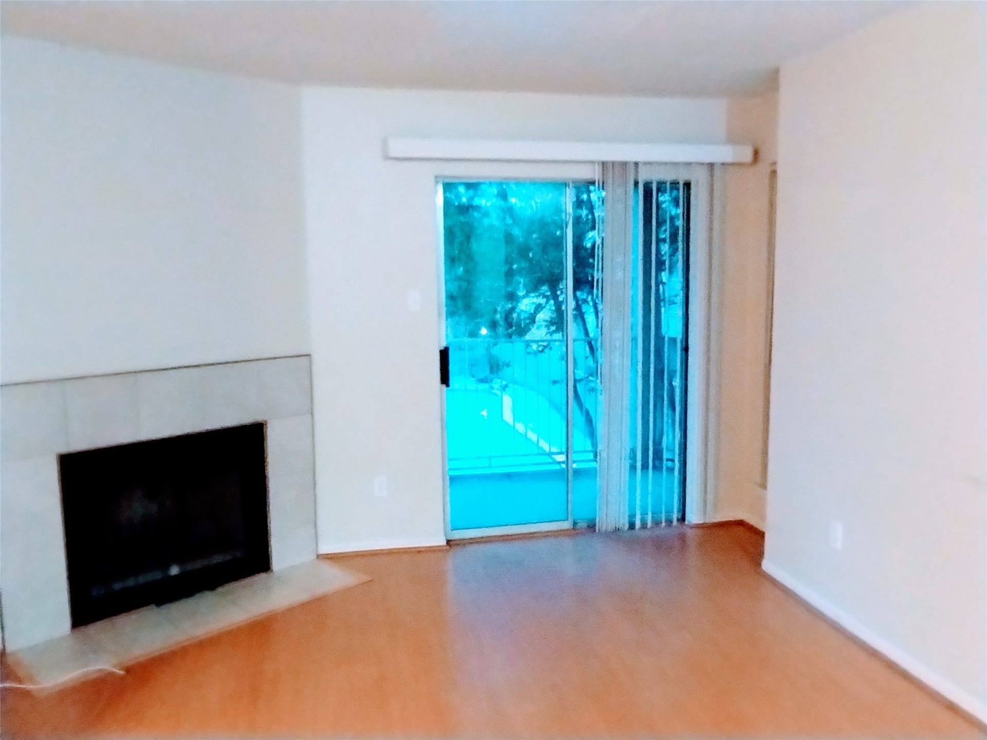 11201 Lynbrook Drive, #3807, Houston, TX 77042 The LIVING ROOM is spacious with generous wall space for furniture placement and your art collection. The sliding doors open to the Balcony/Terrace that overlooks a beautiful pool and plentiful trees.
