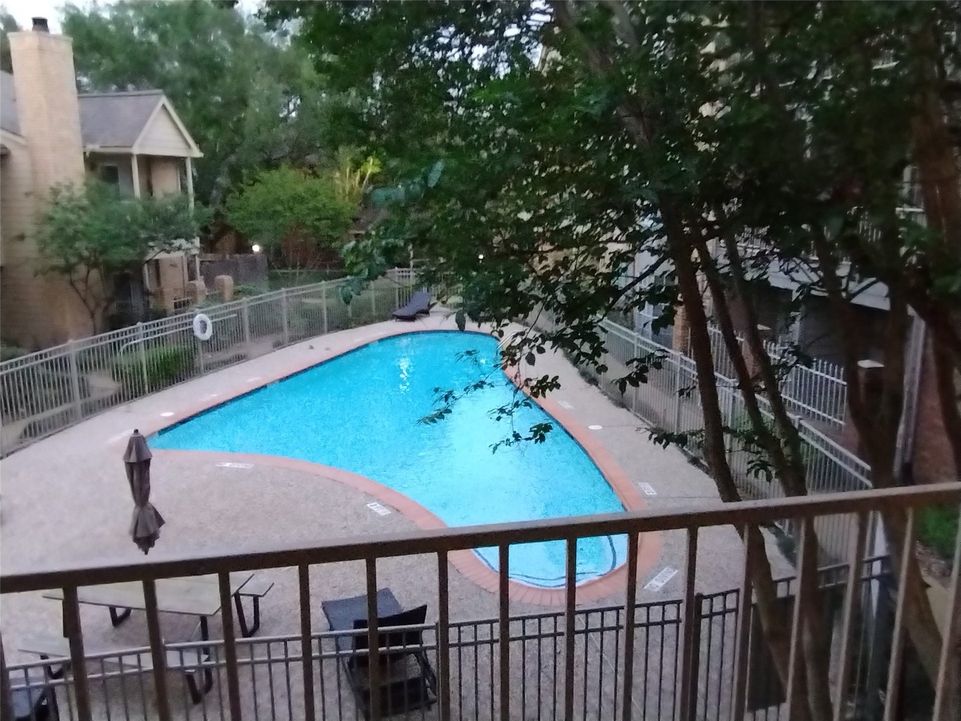 11201 Lynbrook Drive, #3807, Houston, TX 77042 Enjoy delightful views from the BALCONY TERRACE of 11201 LYNBROOK DR. #3807 of a lovely pool with wrought iron security fencing and mature trees. Ample space on the Balcony for outdoor furniture.