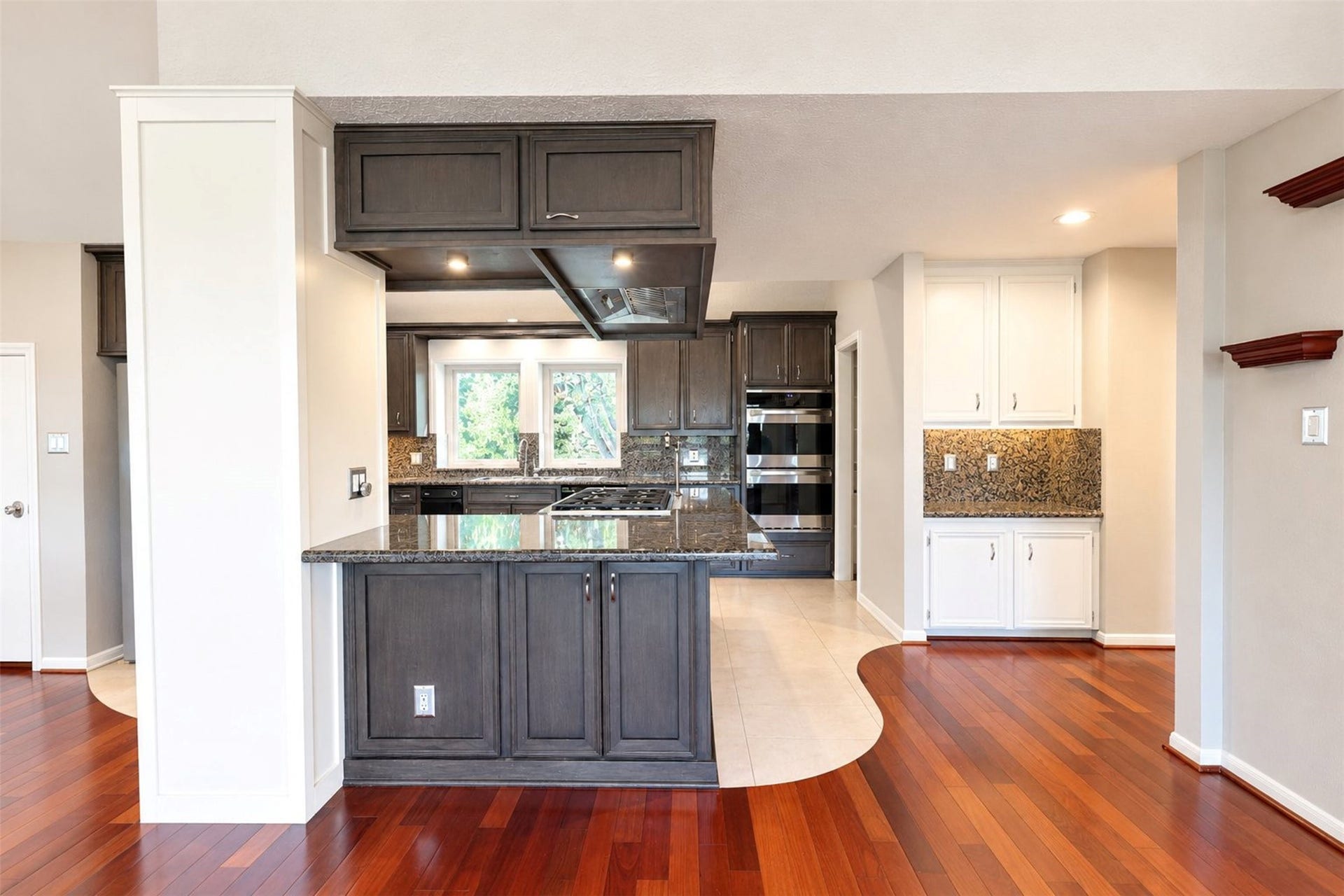 Room for bar stools, lots of storage double ovens, bamboo floors all make this a dream kitchen to cook or bake in.