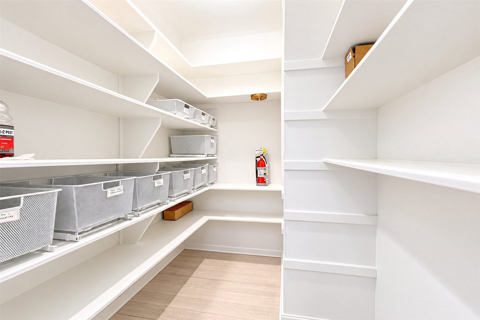 Walk in pantry with attached baskets.