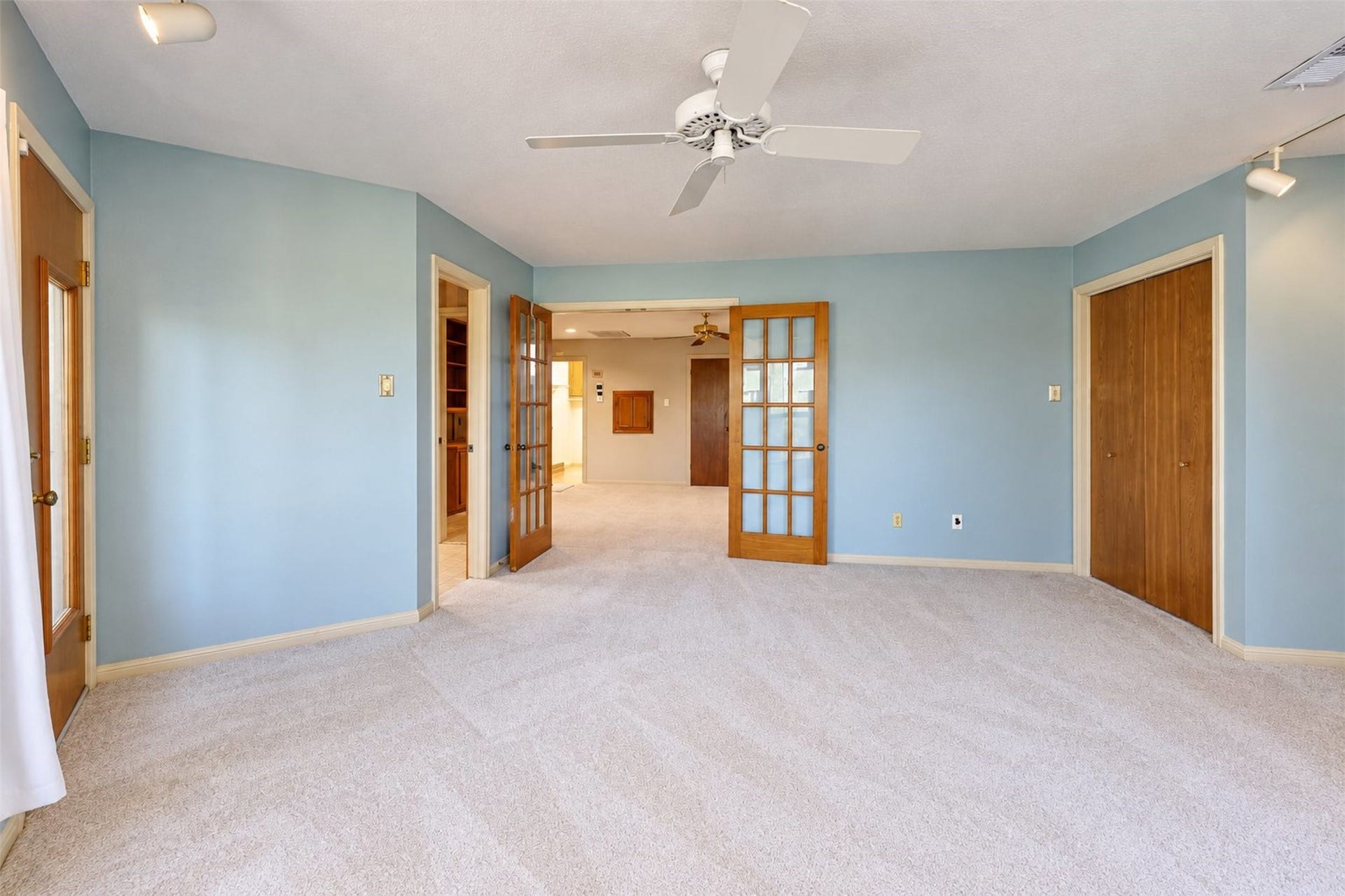 Third bedroom has access to the backyard.