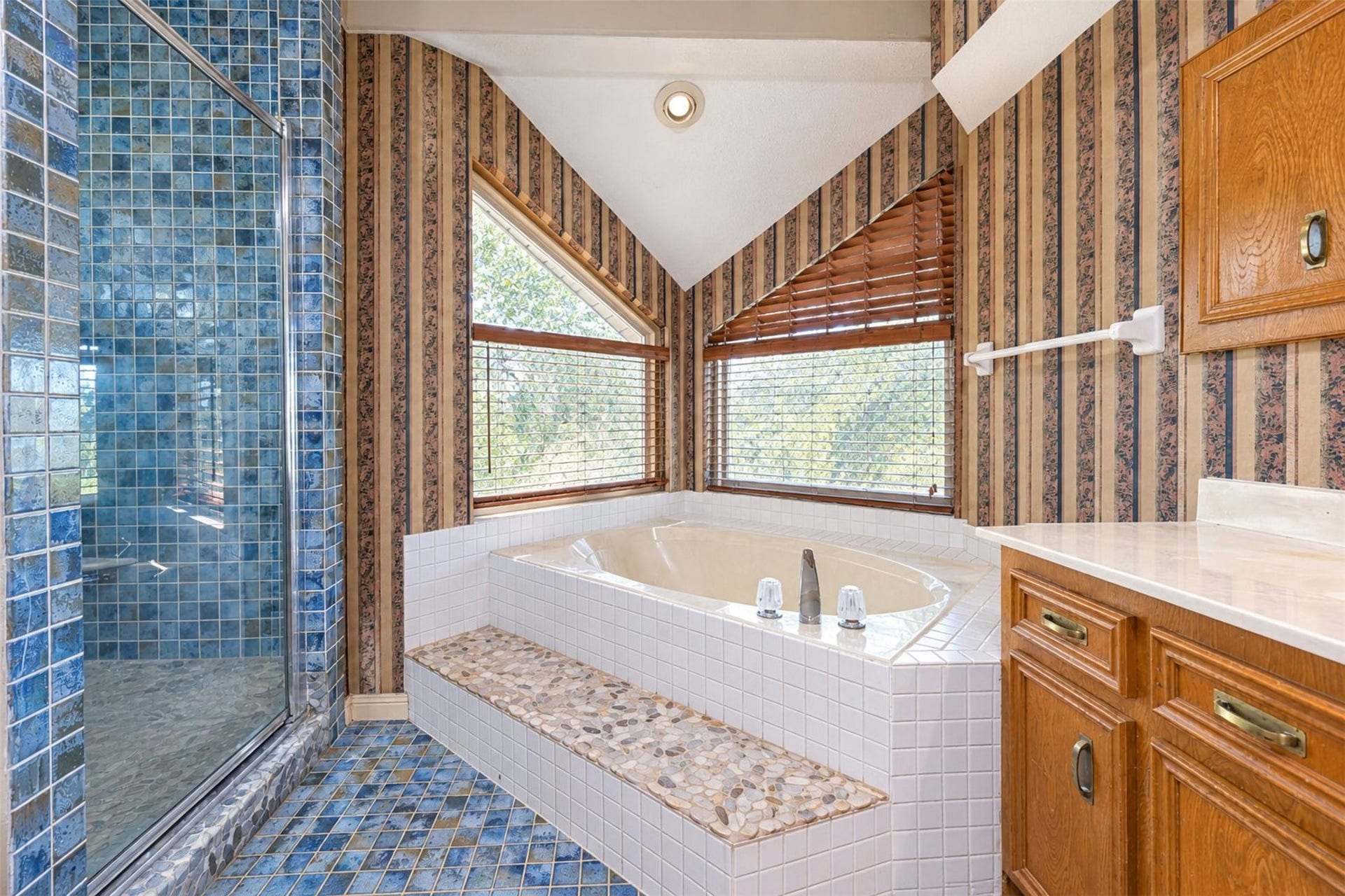 Primary bath features a soaker tub and separate shower.