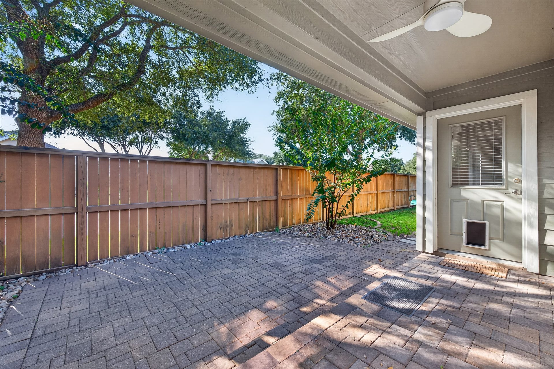 Enjoy a peaceful, private patio with plenty of shade and space to relax or entertain.