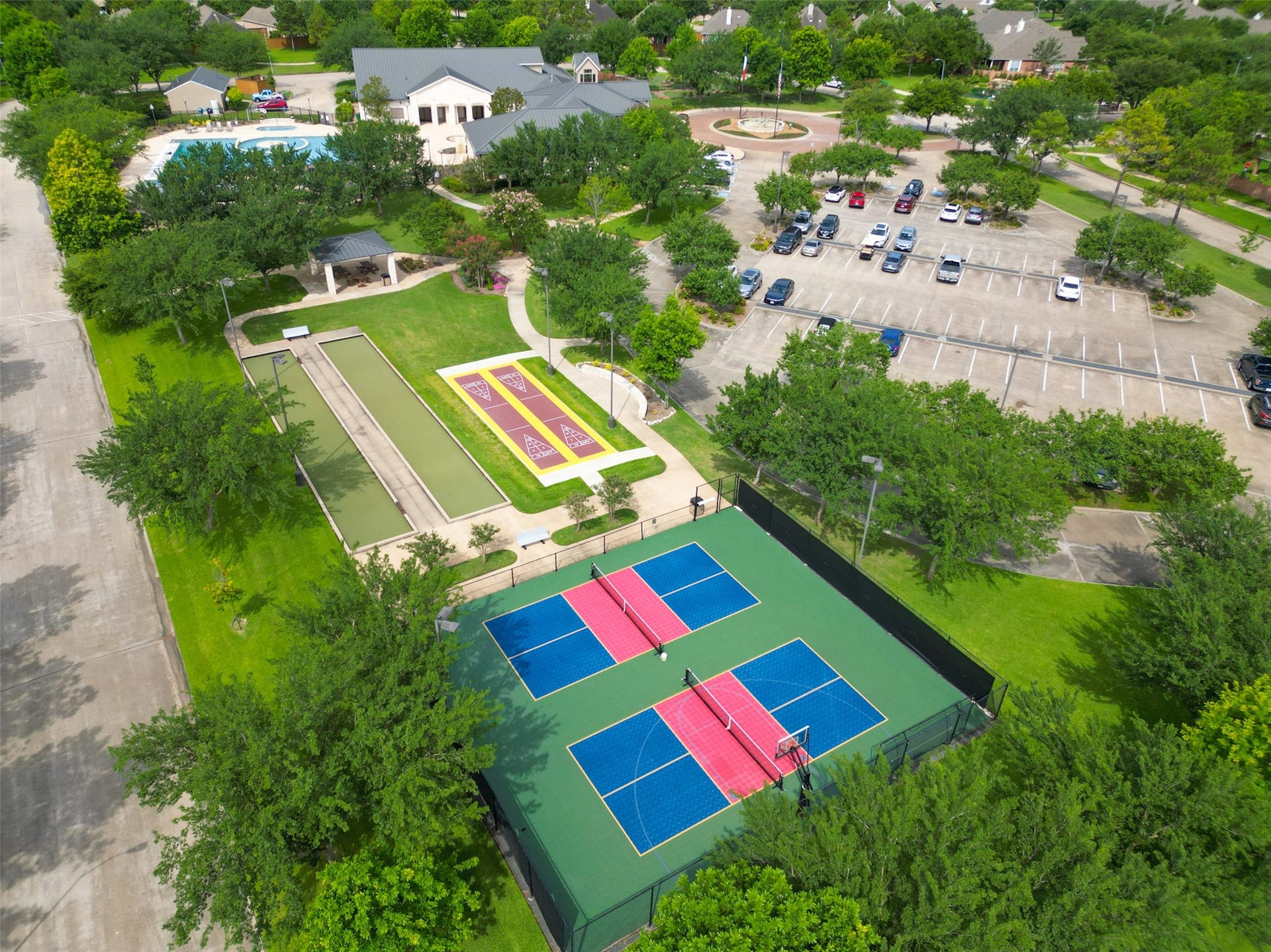 Pickle-ball court - Net can be rolled to the side to allow full access to the basketball hoop.