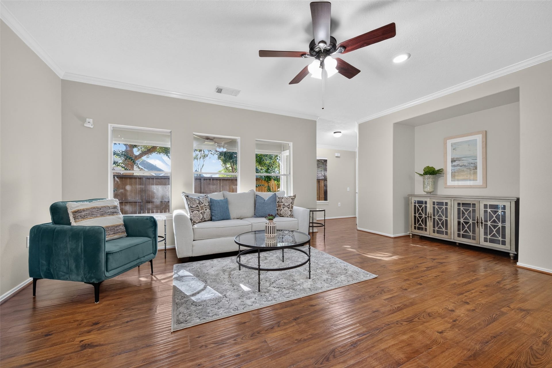 Enjoy lovely backyard views and a versatile layout with plenty of room to relax. A distinctive architectural cutout creates a dedicated television nook, adding character and functionality to the space.
