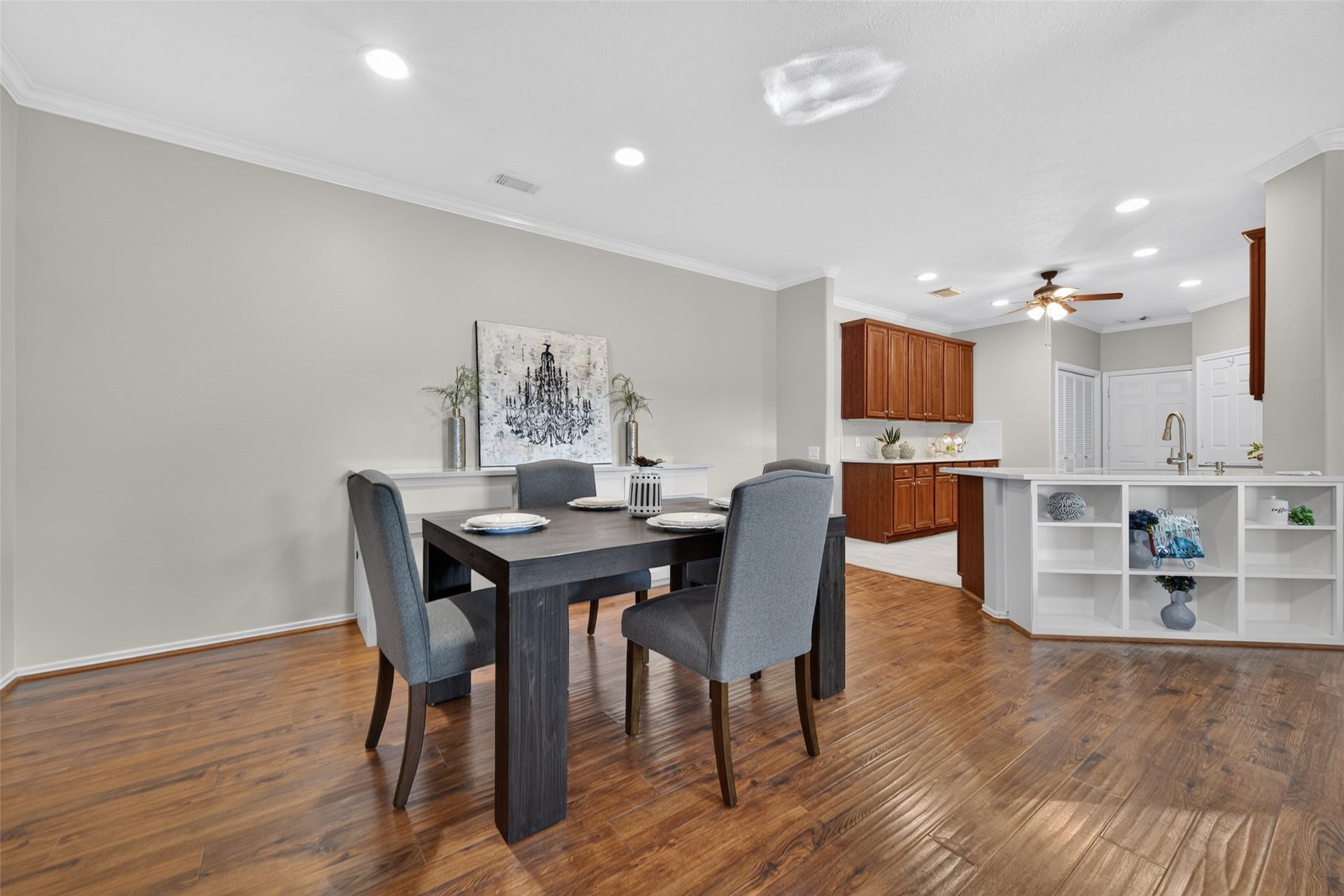 The open layout creates a seamless flow from the dining area into the kitchen, making everyday living and entertaining easy and inviting.