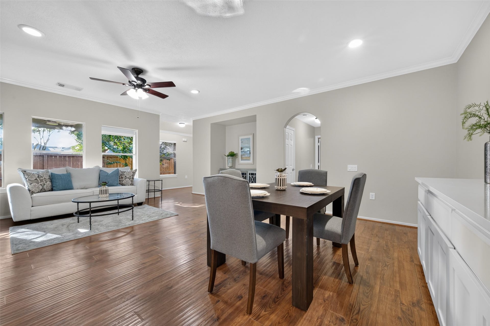 Beautiful hardwood floors flow seamlessly from the dining area into the cozy family room.