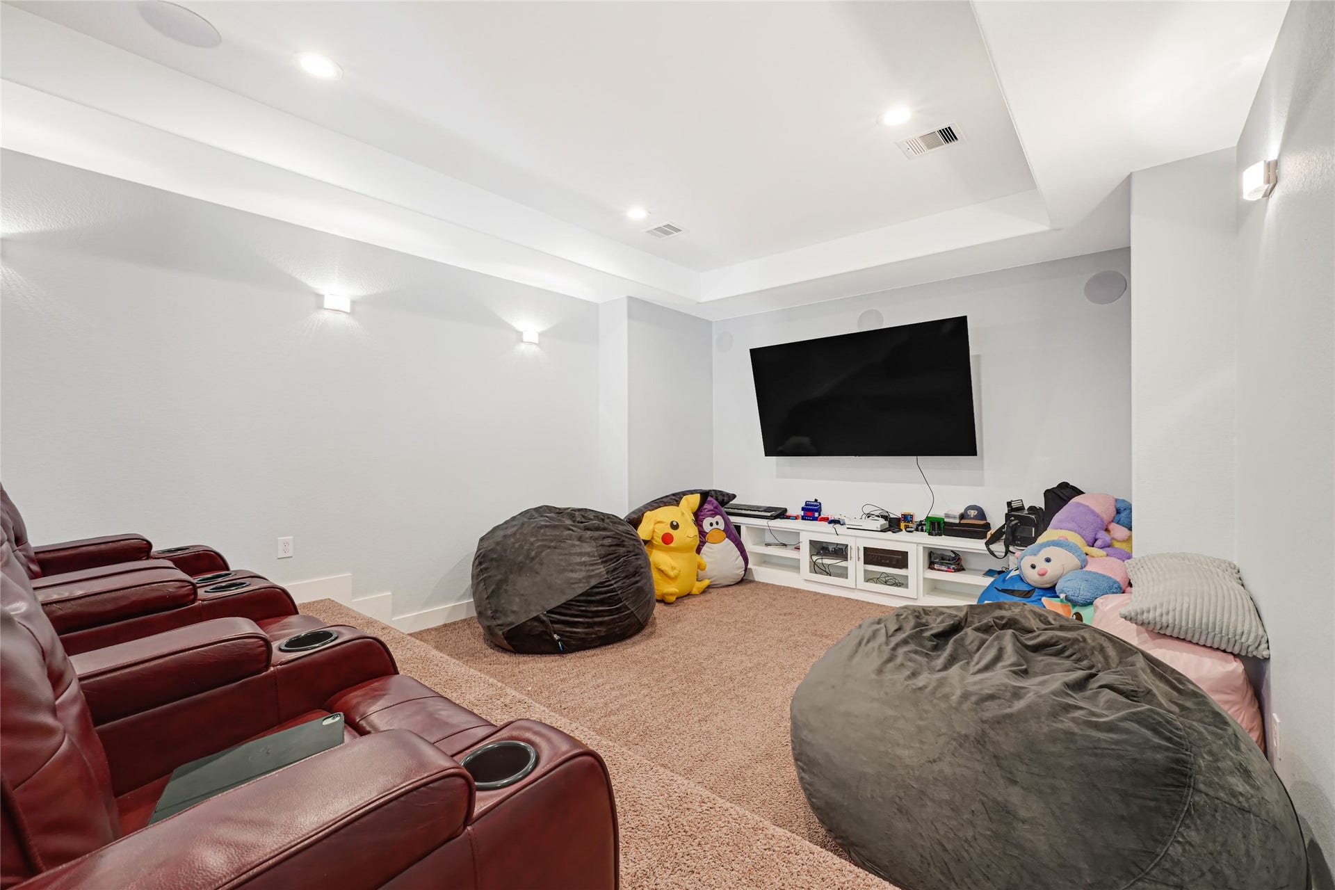 4210 Hidden Winds Drive, Spring, TX 77386 Spacious media room provides a comfortable setting for movie nights and entertainment.