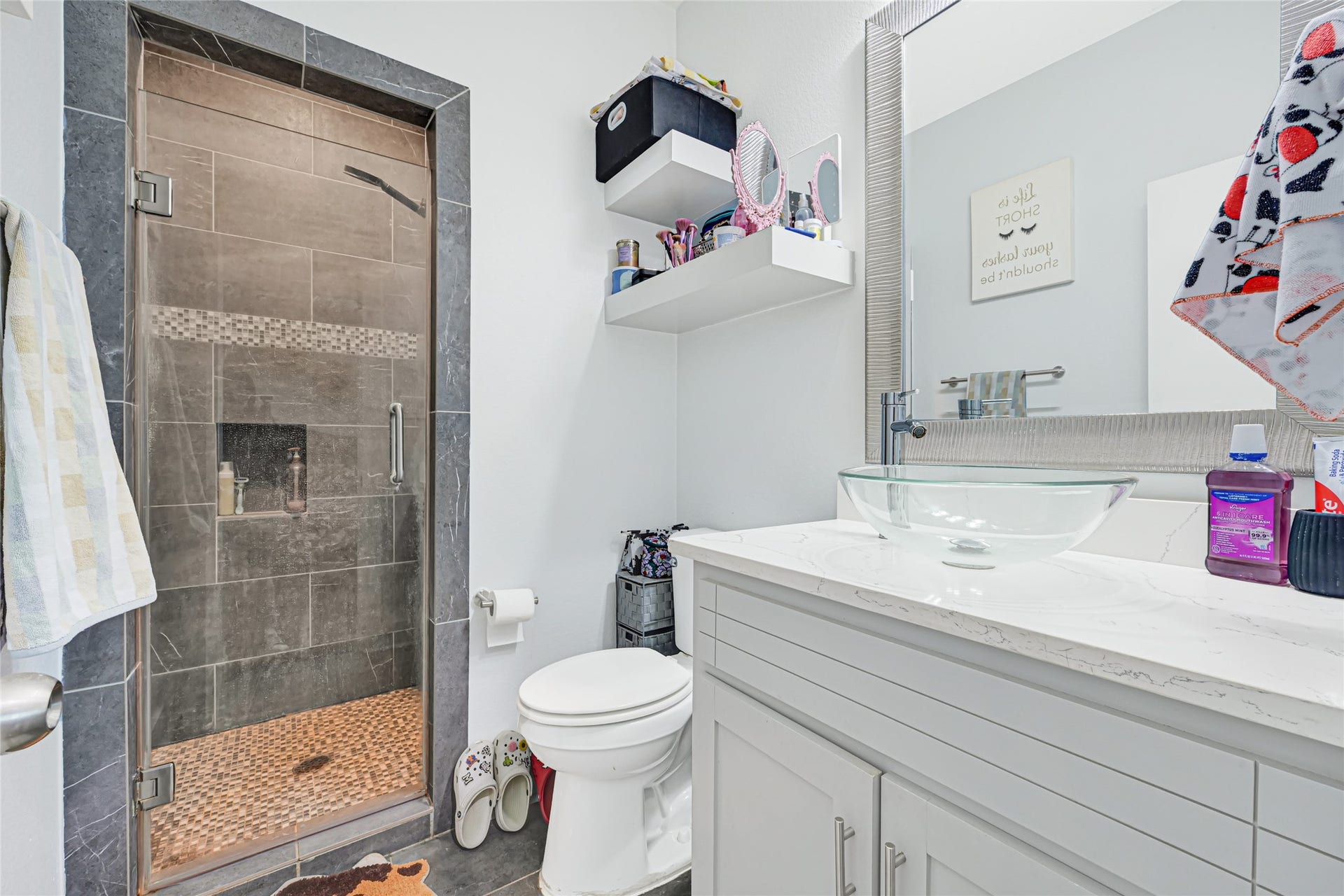 4210 Hidden Winds Drive, Spring, TX 77386 Bathroom features a vanity with cabinet storage and a separate tiled shower.