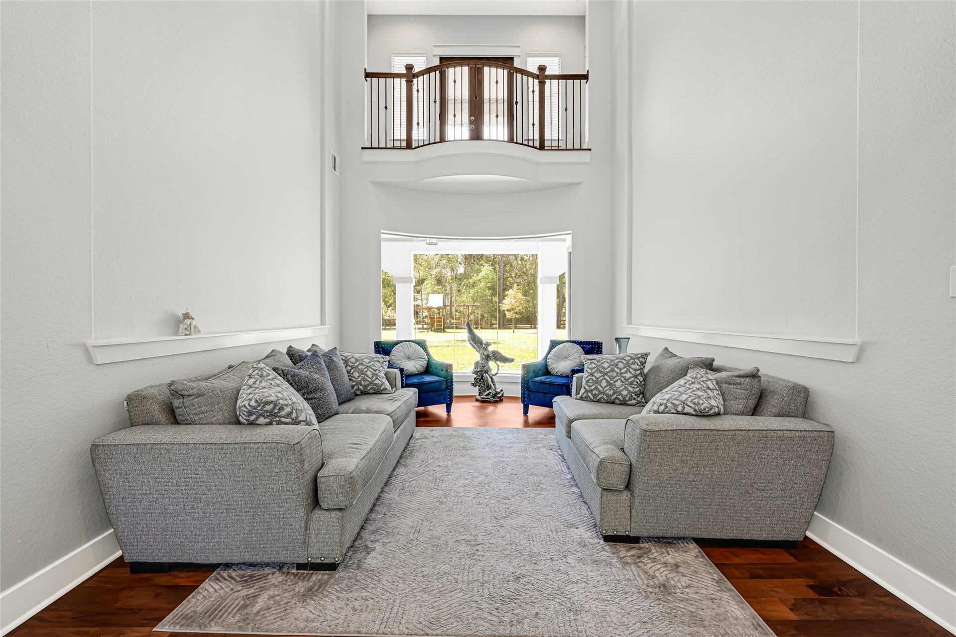 4210 Hidden Winds Drive, Spring, TX 77386 Formal living room features soaring ceilings and a tall window that fills the space with natural light.