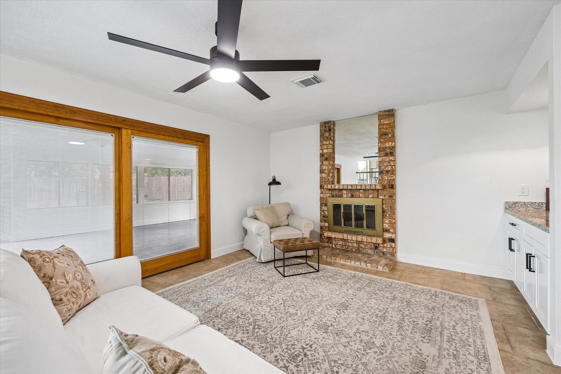 21502 River Court Drive, Katy, TX 77449 Spacious living area that flows seamlessly into your indoor patio, creating the perfect space to relax and unwind.