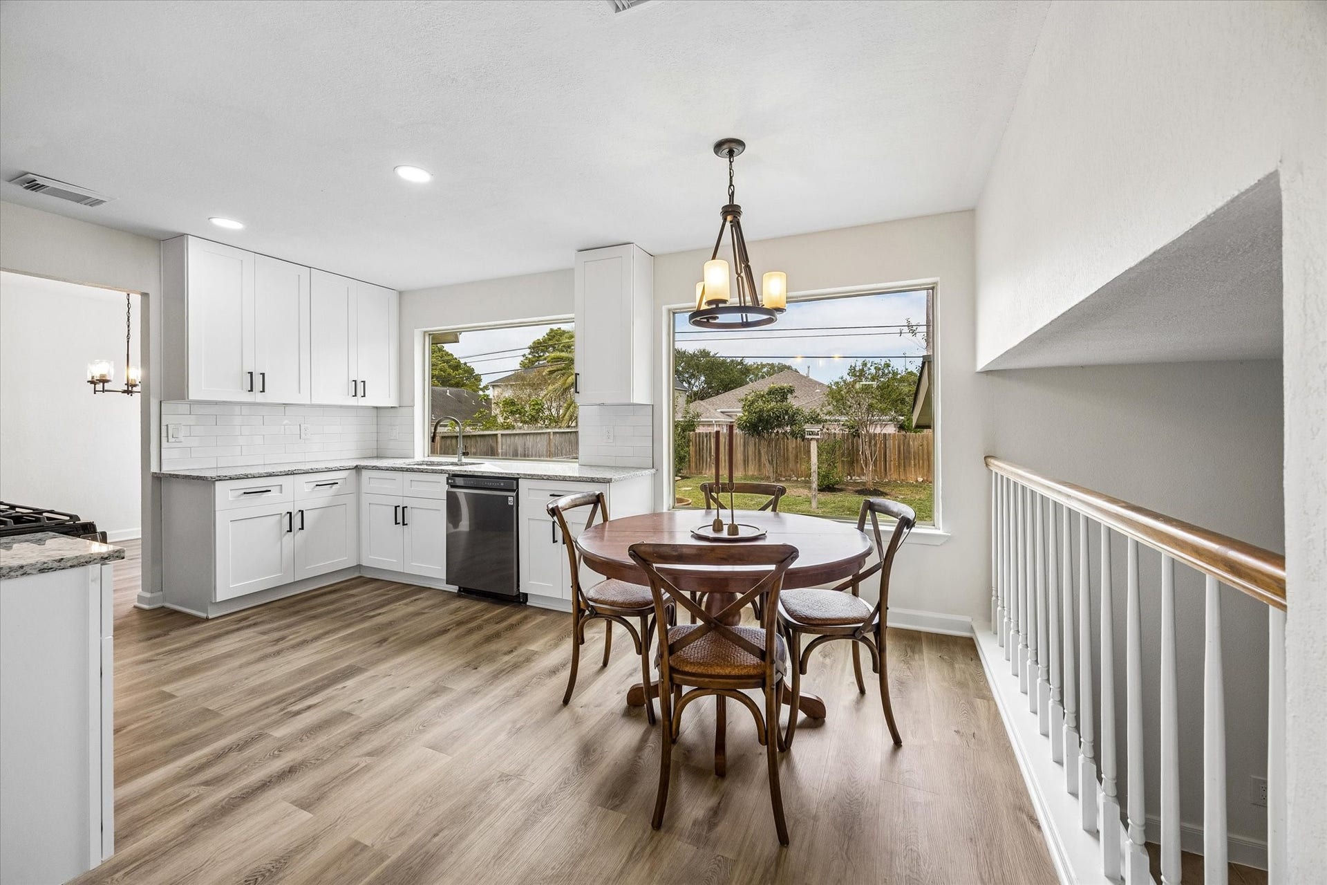21502 River Court Drive, Katy, TX 77449 Beautiful, oversized windows offer peaceful views of your backyard while you cook, bringing natural light and a touch of the outdoors into your kitchen.