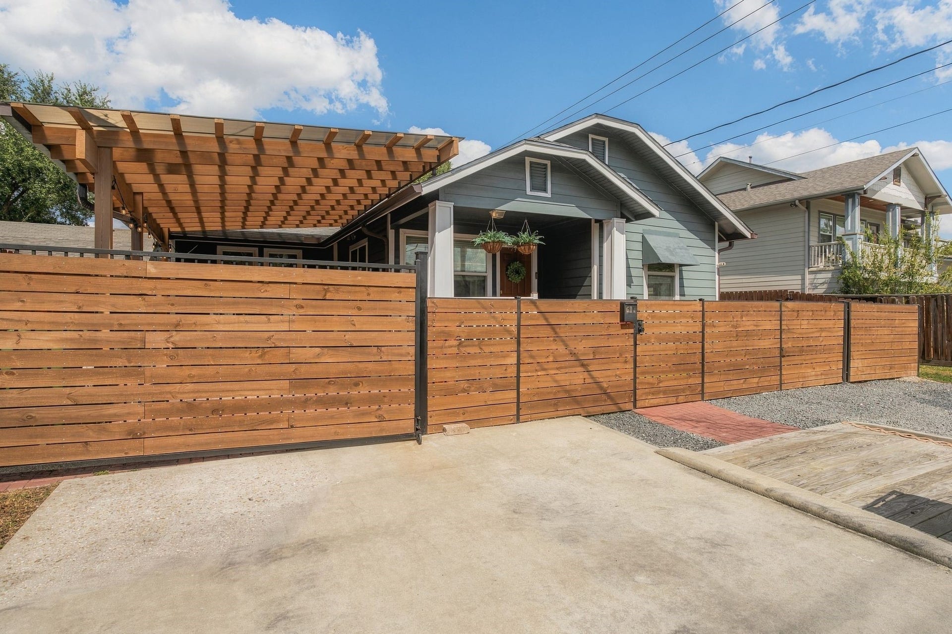 614 Coronado Street, Houston, TX 77009 Rare double-wide driveway with gated access to a covered carport that can also serve as a flexible outdoor entertaining space. Exceptional off-street parking for this established Inner Loop neighborhood.