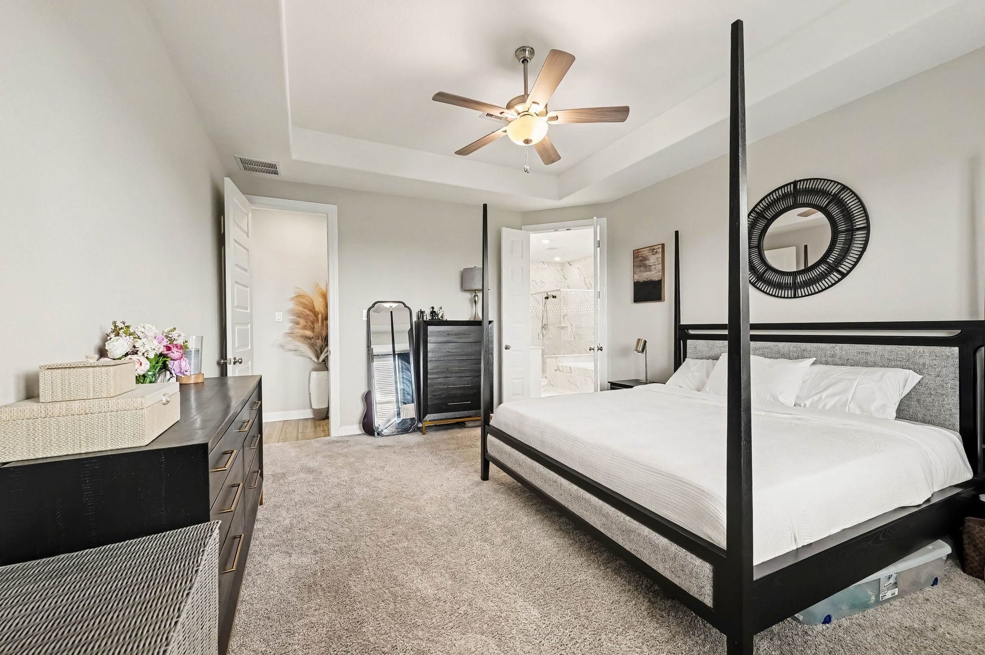 5107 Autumn Hills Trail, Pearland, TX 77584 Primary Bedroom: A spacious and serene retreat featuring abundant natural light, elegant finishes, and plenty of room to unwind, with convenient access to the spa-inspired ensuite bath and impressive walk-in closet.