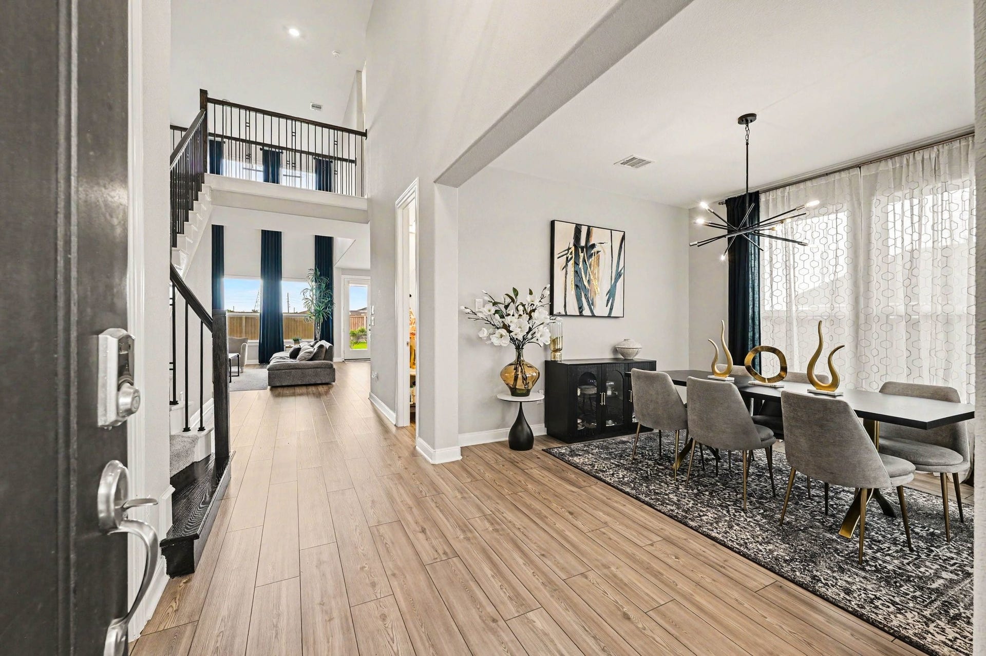 5107 Autumn Hills Trail, Pearland, TX 77584 An Elegant Arrival Step inside to a sophisticated dining space where modern lighting, stylish finishes, and an open design make entertaining feel effortless.