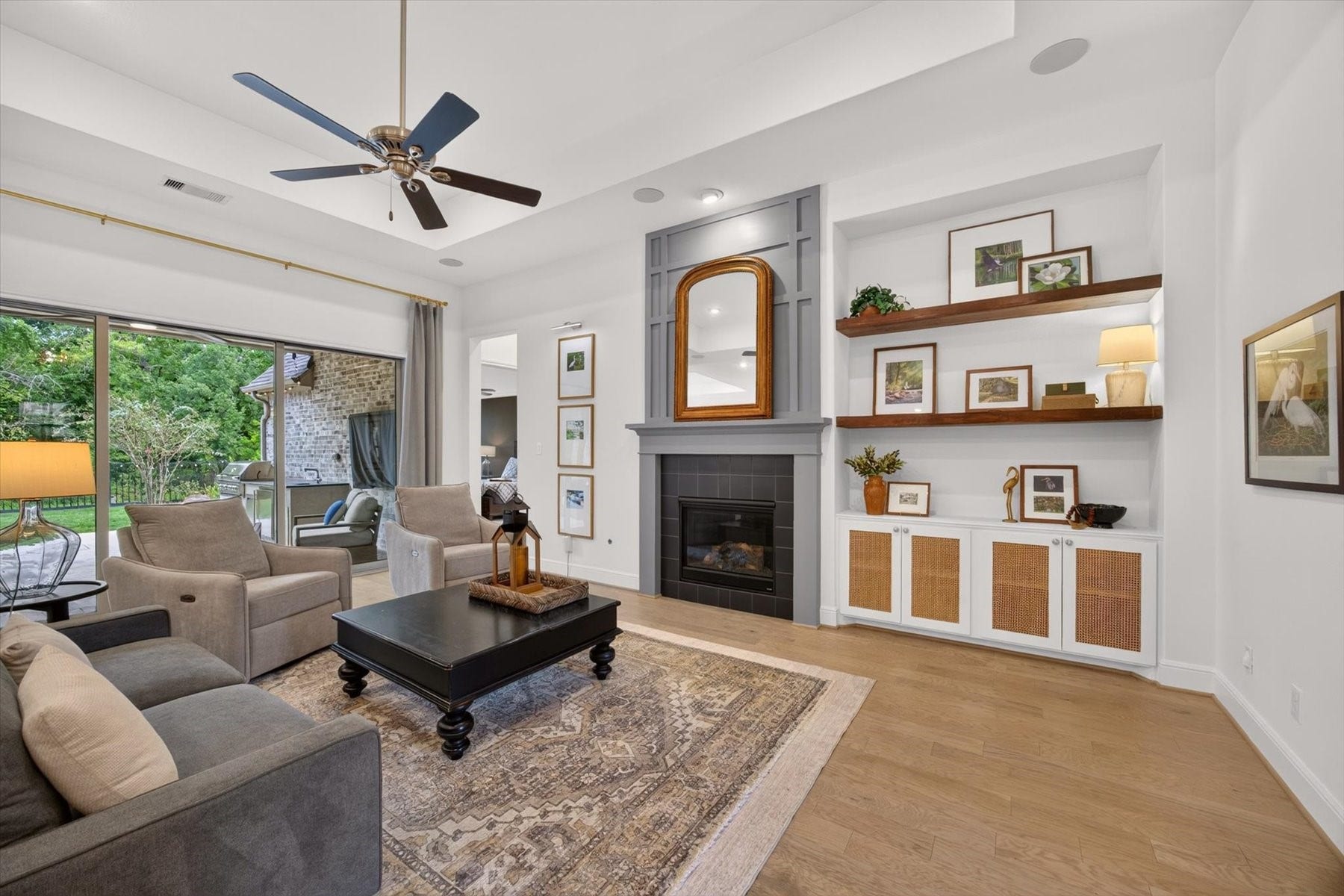 1219 Mcmurtry Ridge Drive, Katy, TX 77494 The living room features a fireplace and custom built in cabinetry.