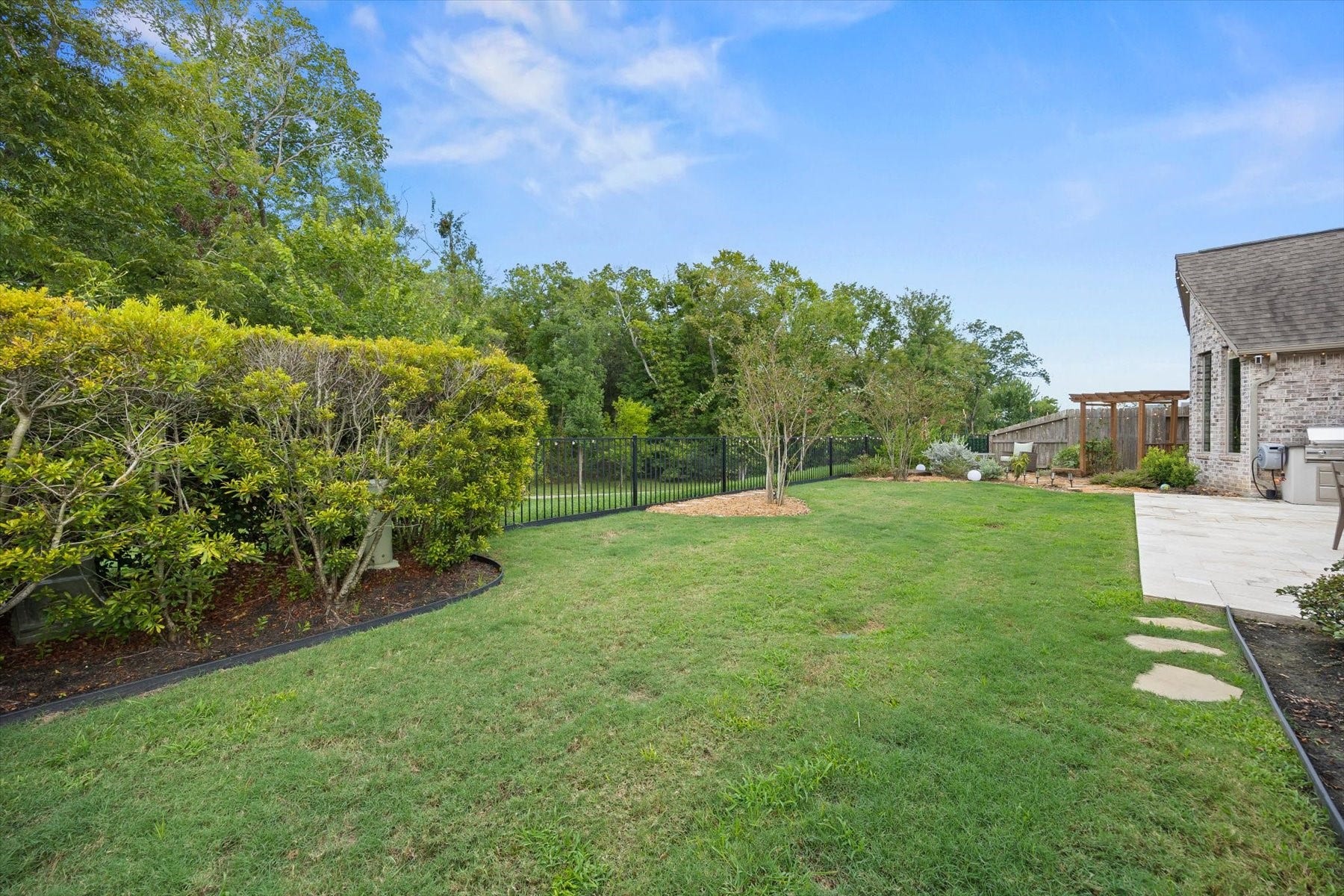 1219 Mcmurtry Ridge Drive, Katy, TX 77494 Scenic space with mature trees, offering a peaceful wooded backdrop