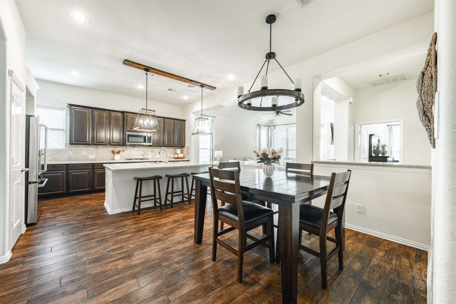 6003 Hedgepark Drive, Richmond, TX 77407 Photos include both previously furnished rooms and the homes current vacant condition to help buyers visualize the space and layout.