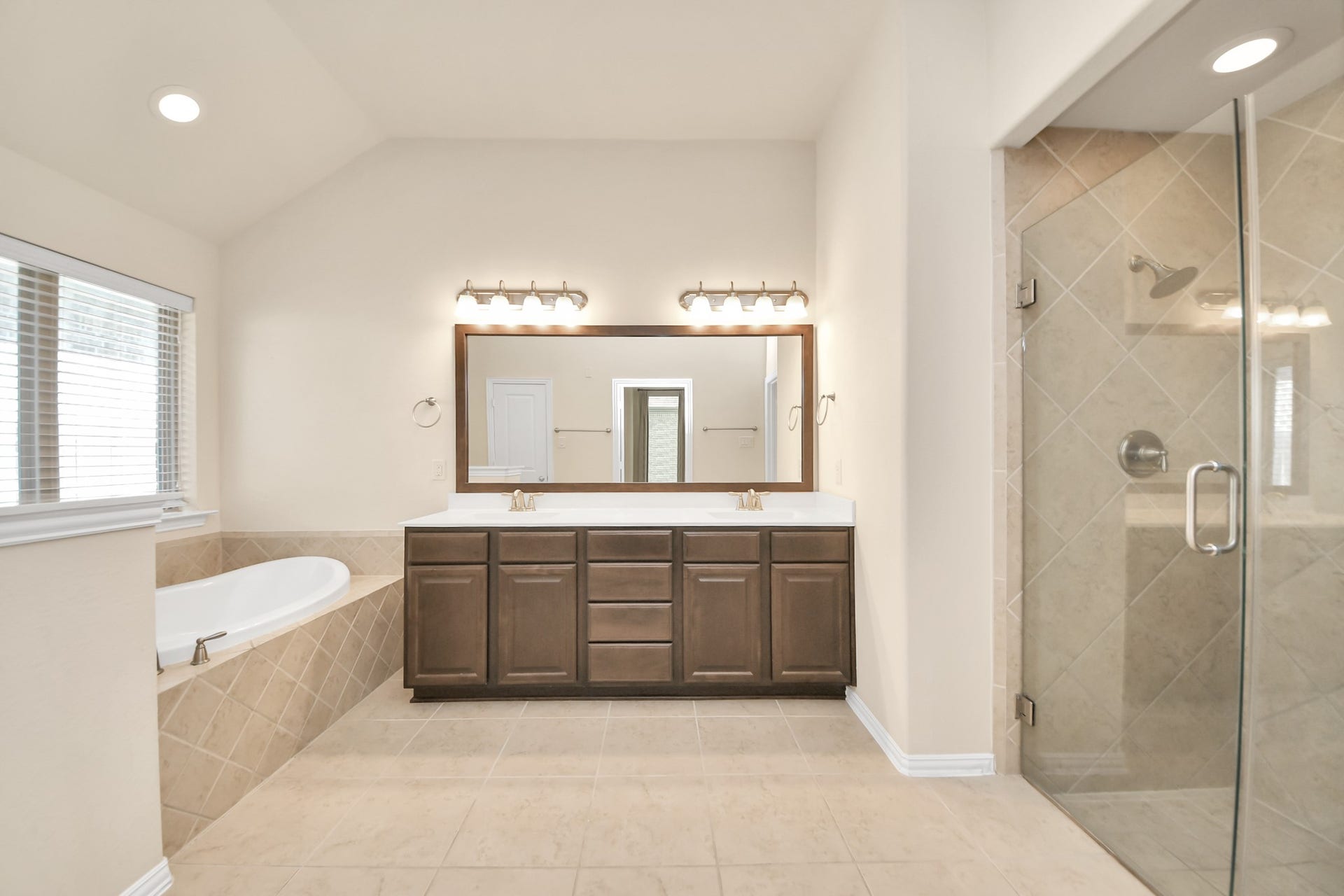 6003 Hedgepark Drive, Richmond, TX 77407 Photos include both previously furnished rooms and the homes current vacant condition to help buyers visualize the space and layout.
