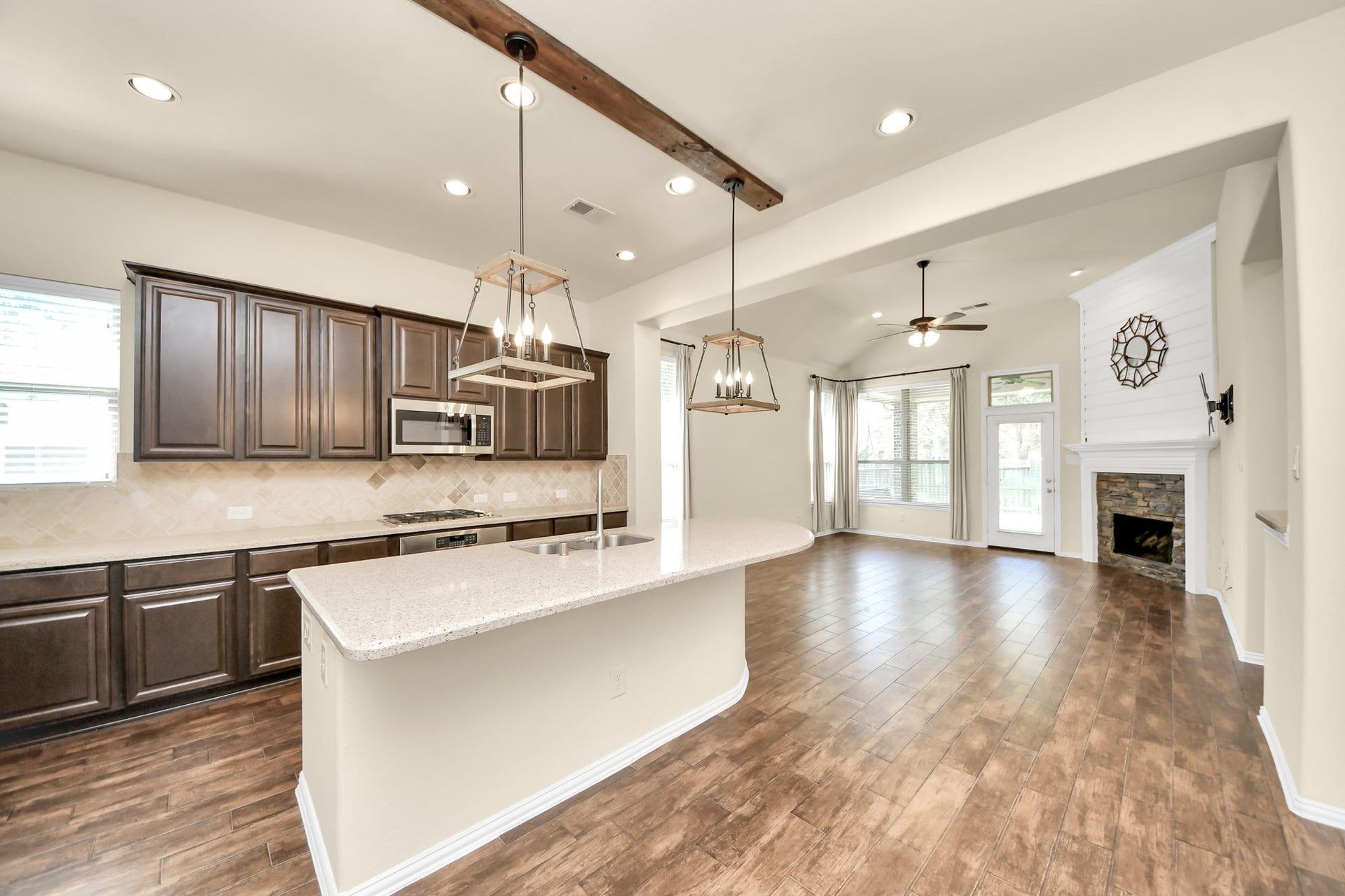 6003 Hedgepark Drive, Richmond, TX 77407 Photos include both previously furnished rooms and the homes current vacant condition to help buyers visualize the space and layout.