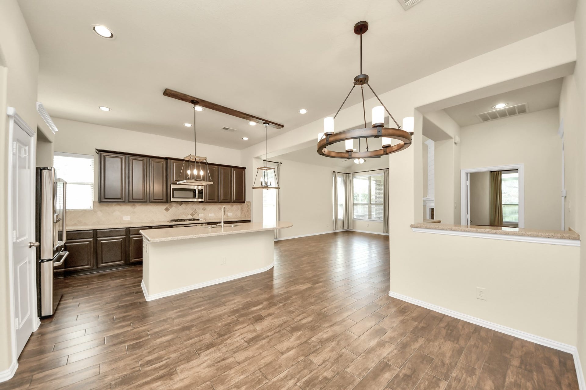 6003 Hedgepark Drive, Richmond, TX 77407 Photos include both previously furnished rooms and the homes current vacant condition to help buyers visualize the space and layout.