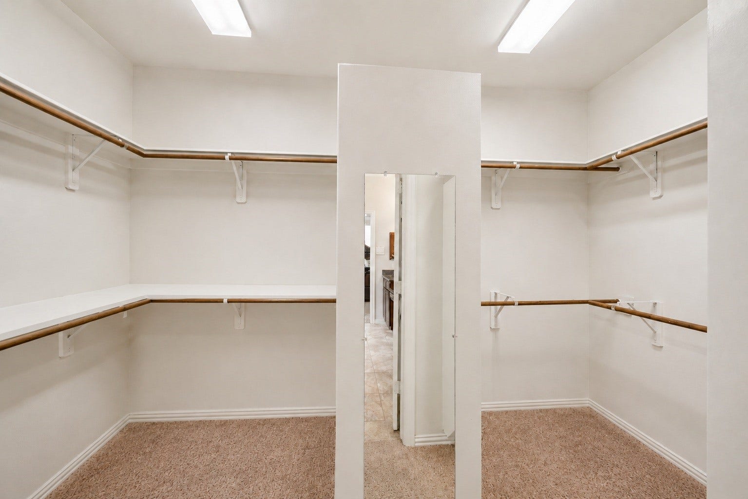 This impressive primary closet offers generous square footage and a smart layout tailored for two.