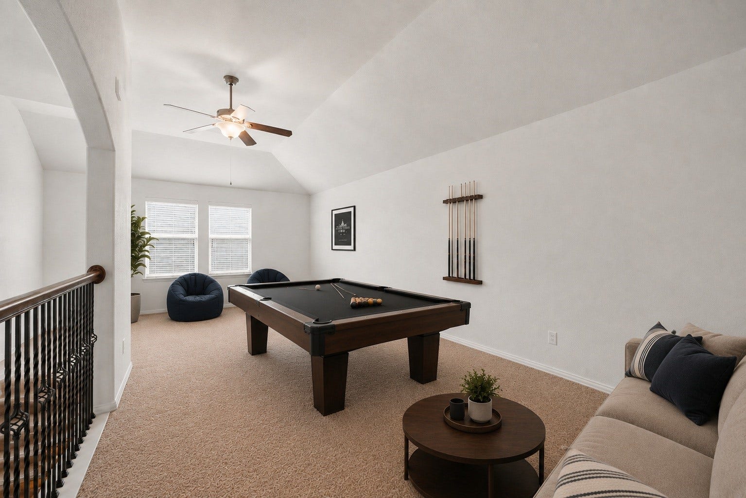 Virtually Staged: Showcasing the impressive scale of this upper-level flex space, this perspective highlights high vaulted ceilings and an expansive wall perfect for a large media setup, gaming area, or home theater.