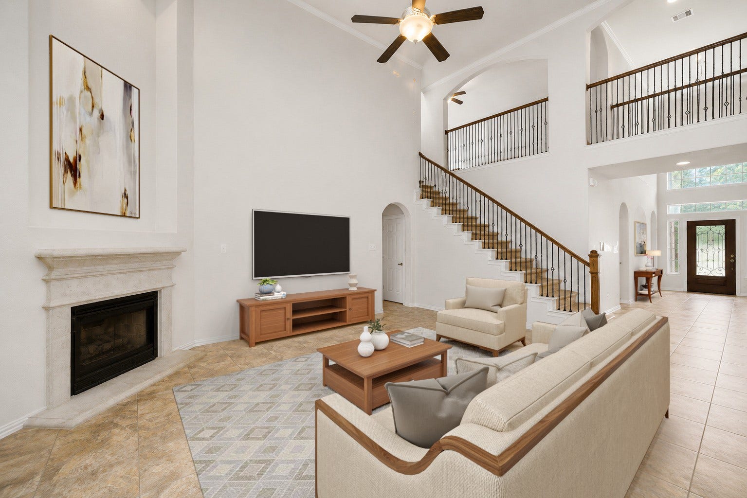 Virtually Staged: Experience a truly welcoming heart of the home designed around volume, warmth, and open sightlines. Soaring walls provide a spacious backdrop for relaxation and entertainment, while the central fireplace adds a classic touch.