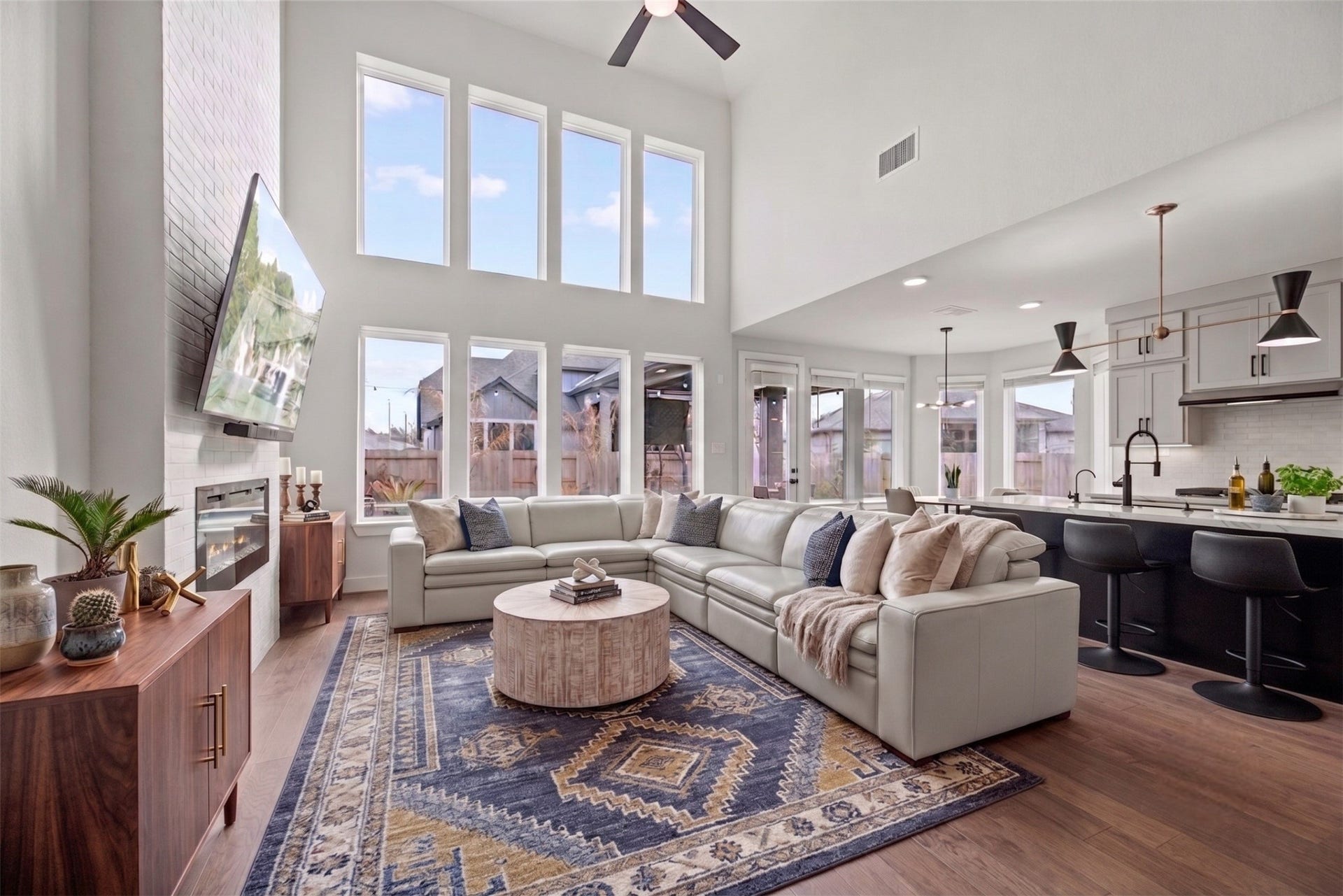 Now into the living space. High or intricately designed ceilings can draw the eye upward, adding a sense of grandeur and elegance to the room. Virtually staged.