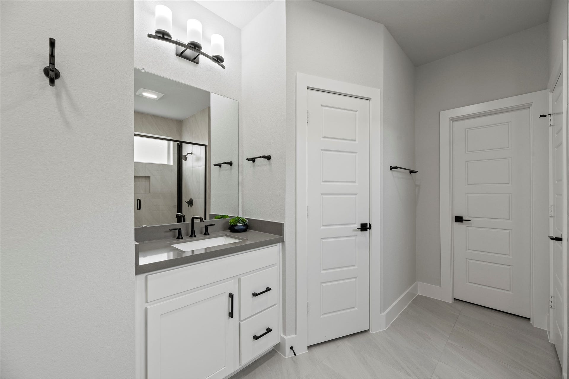 Separate vanities in your primary bath, offer personal space with tons of dedicated cabinet space.