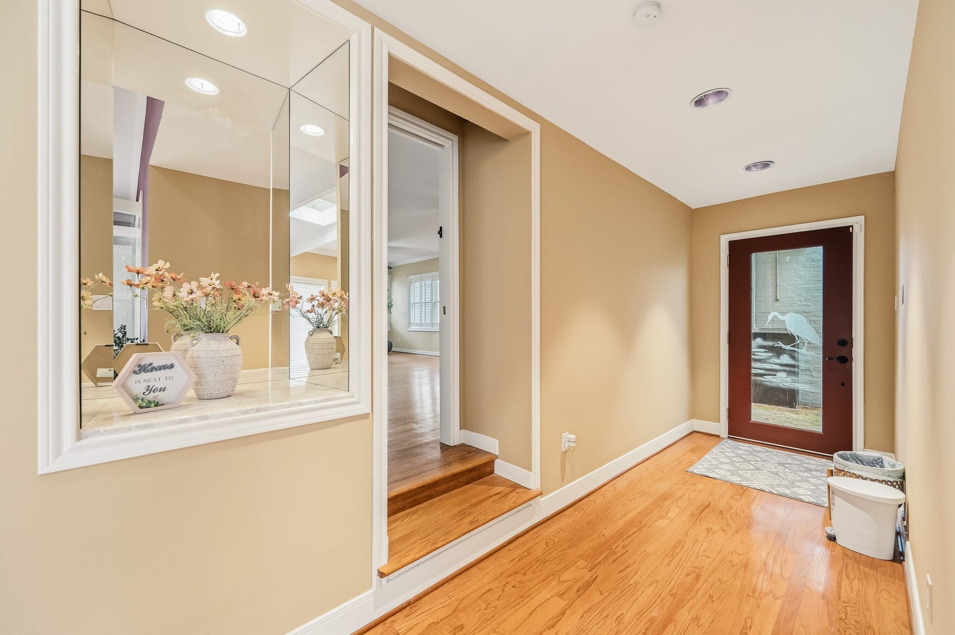 2111 N Galveston Avenue, Pearland, TX 77581 Enter into a bright and airy open-concept living space filled with natural light. The primary suite is thoughtfully positioned at the front of the home on the right, complete with pocket doors for enhanced privacy.