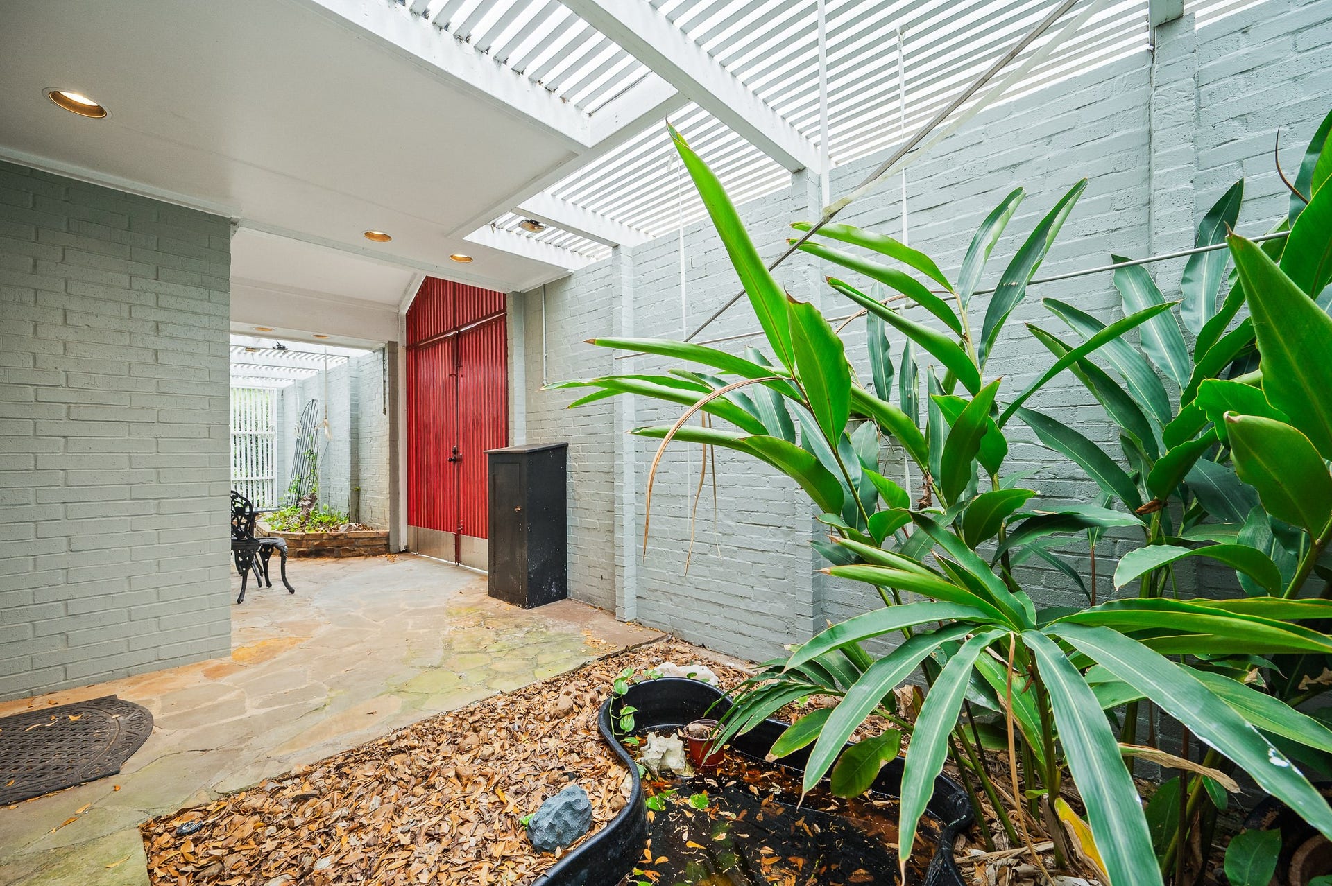 2111 N Galveston Avenue, Pearland, TX 77581 Step onto the inviting covered porch bathed in natural light.