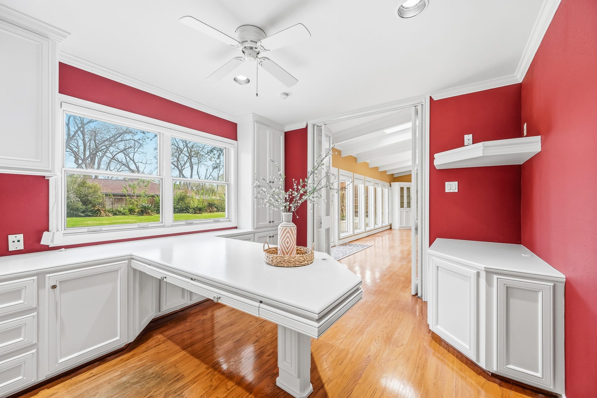 2111 N Galveston Avenue, Pearland, TX 77581 A custom home office with a view directly into the family room, perfect for staying connected while working.