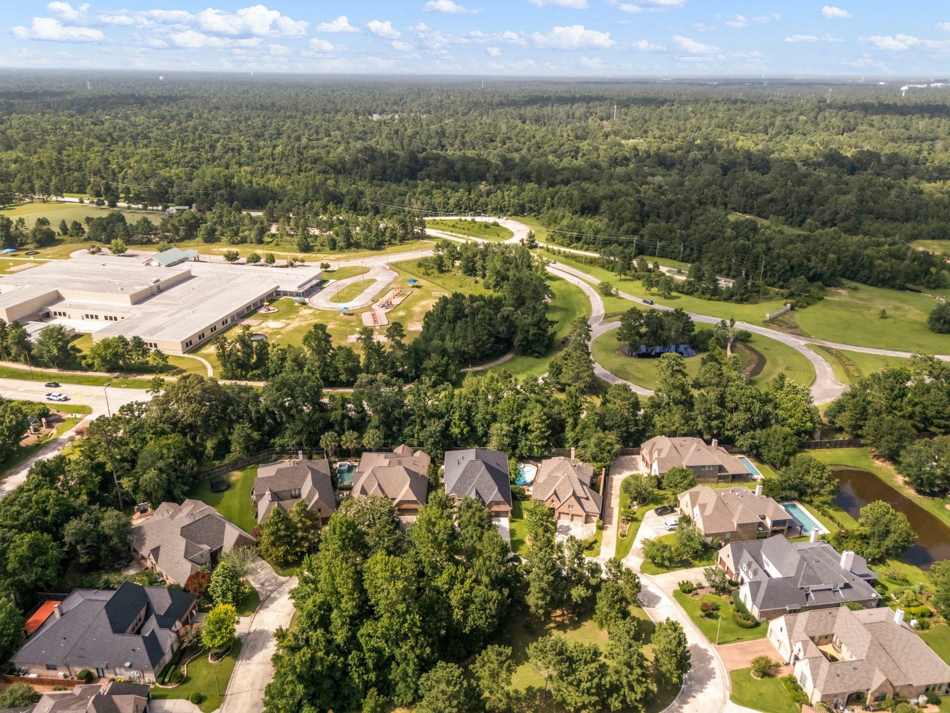 195 Oarwood Place, The Woodlands, TX 77389 Tucked away within a private residential loop, the estate is surrounded by a dense canopy of mature trees, offering unmatched privacy and peaceful, scenic views. Enjoy the absolute best of both worlds, secluded, country-style tranquility paired with seamless access to adjacent community pathways and local amenities.
